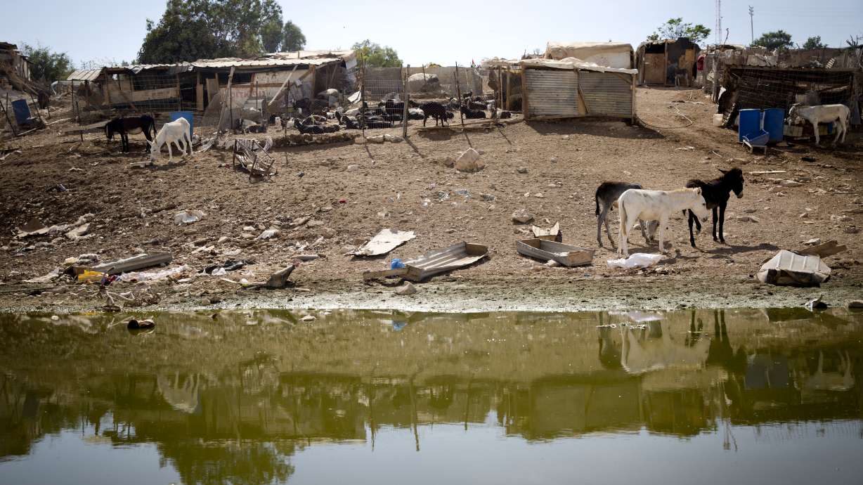 Sewage pool rings West Bank village awaiting demolition