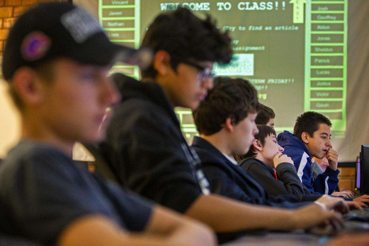 Patrick Obst, right, works on creating ASCII Art on Tuesday in Sarah LaMarche's Programming Fundamentals class at Twin Falls High School in Twin Falls. Photo: Pat Sutphin, Times-News