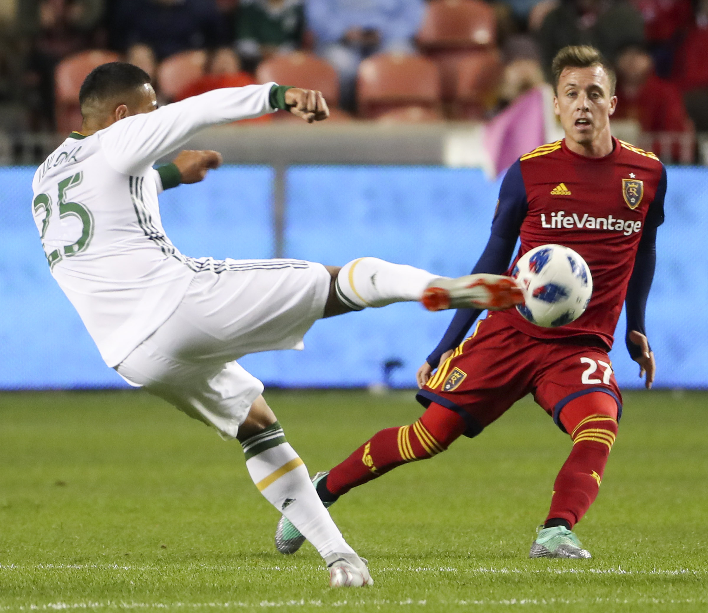 Real Salt Lake forward Corey Baird (27) stays in front off Portland Timbers defender Bill Tuiloma (25)] as he passes the ball during the Portland Timbers versus Real Salt Lake soccer match at Rio Tinto Stadium in Sandy on Saturday, Oct. 6, 2018. (Photo: Steve Griffin, Deseret News)