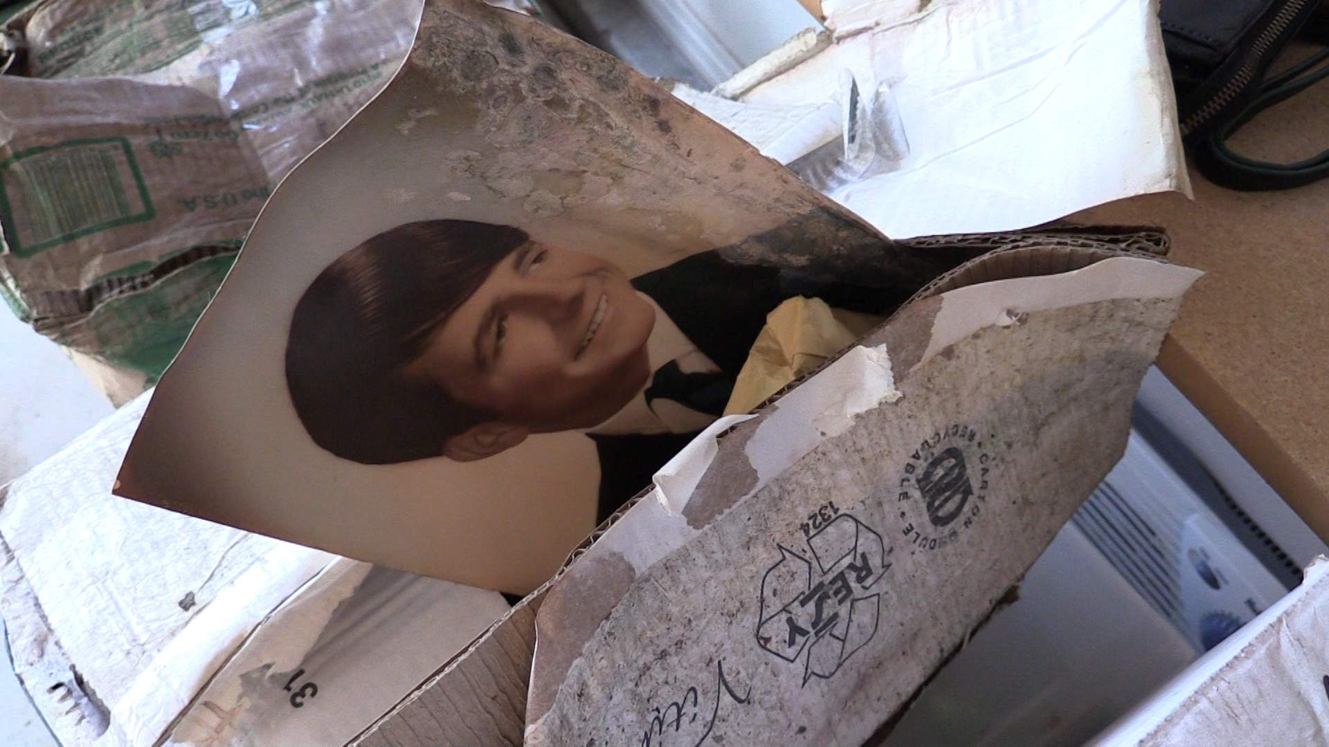 Water-damaged box contained photos and letters from Sharon Harvie’s late husband. (Photo: KSL TV)