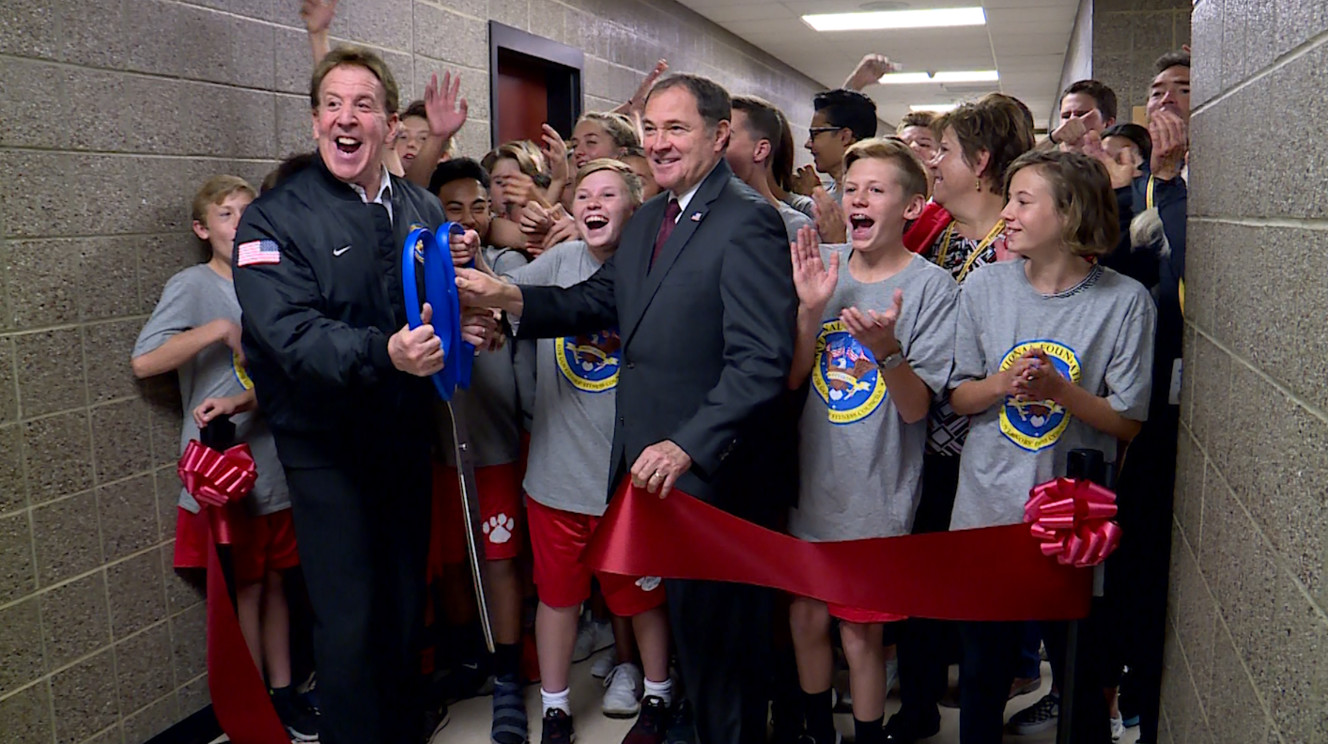 Governor Gary Herbert stands with Jake Steinfeld and students in a ribbon cutting ceremony to celebrate Clayton Middle School's new fitness center. (Photo: KSL TV)