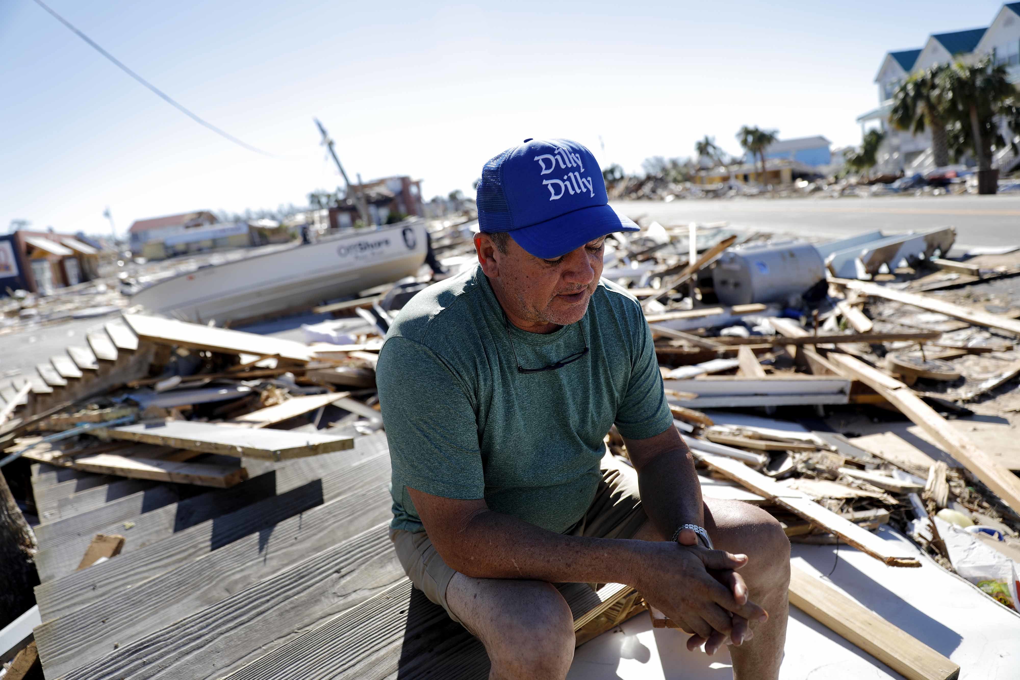 Hurricane survivors wander debris, search for the missing