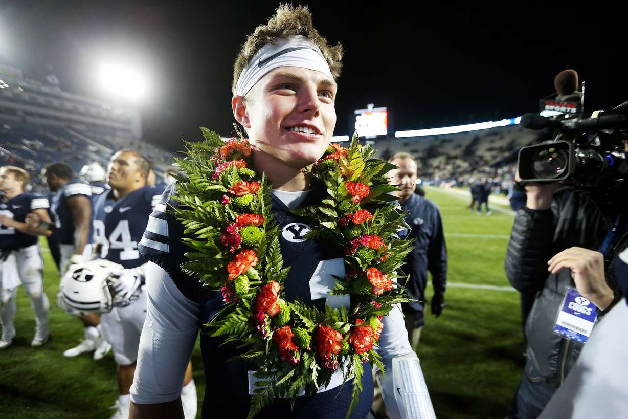 Brigham Young Cougars quarterback Zach Wilson (11) celebrates the win with teammates and fans as BYU defeats Hawaii at LaVell Edwards Stadium 49-23 in Provo on Saturday, Oct. 13, 2018. (Photo: Scott G Winterton, KSL)