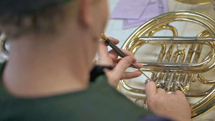 Windy Shaffer’s an expert in the realm of instrument repair, and runs a business she calls “Windy’s Winds.” (Photo: Ray Boone, KSL TV)