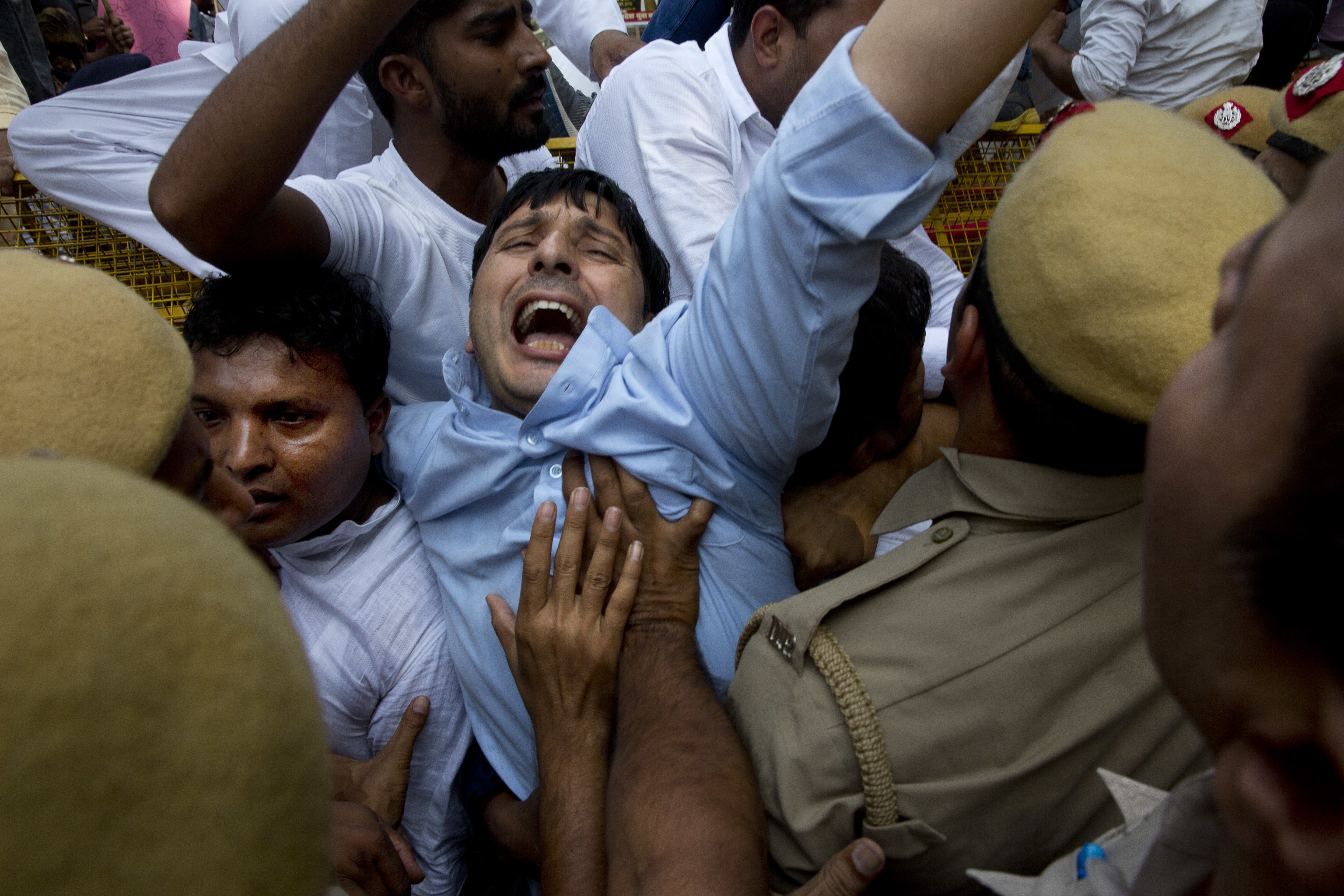 India's accused minister files defamation suit amid protests