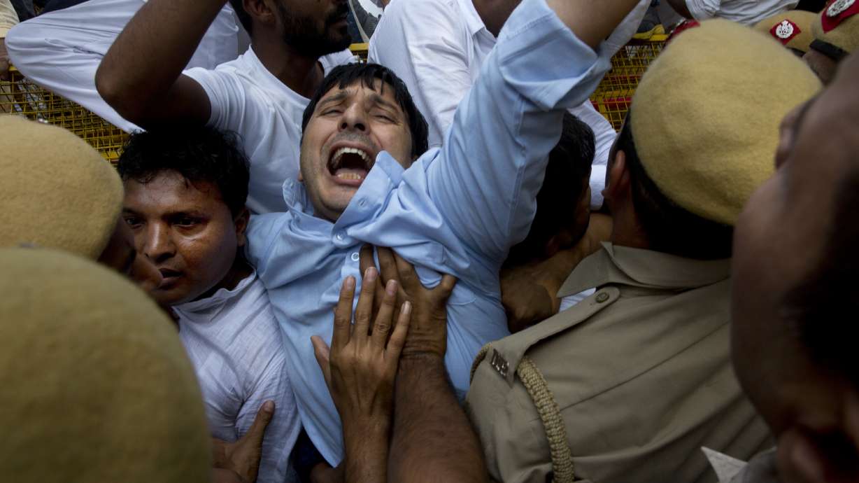 India's accused minister files defamation suit amid protests