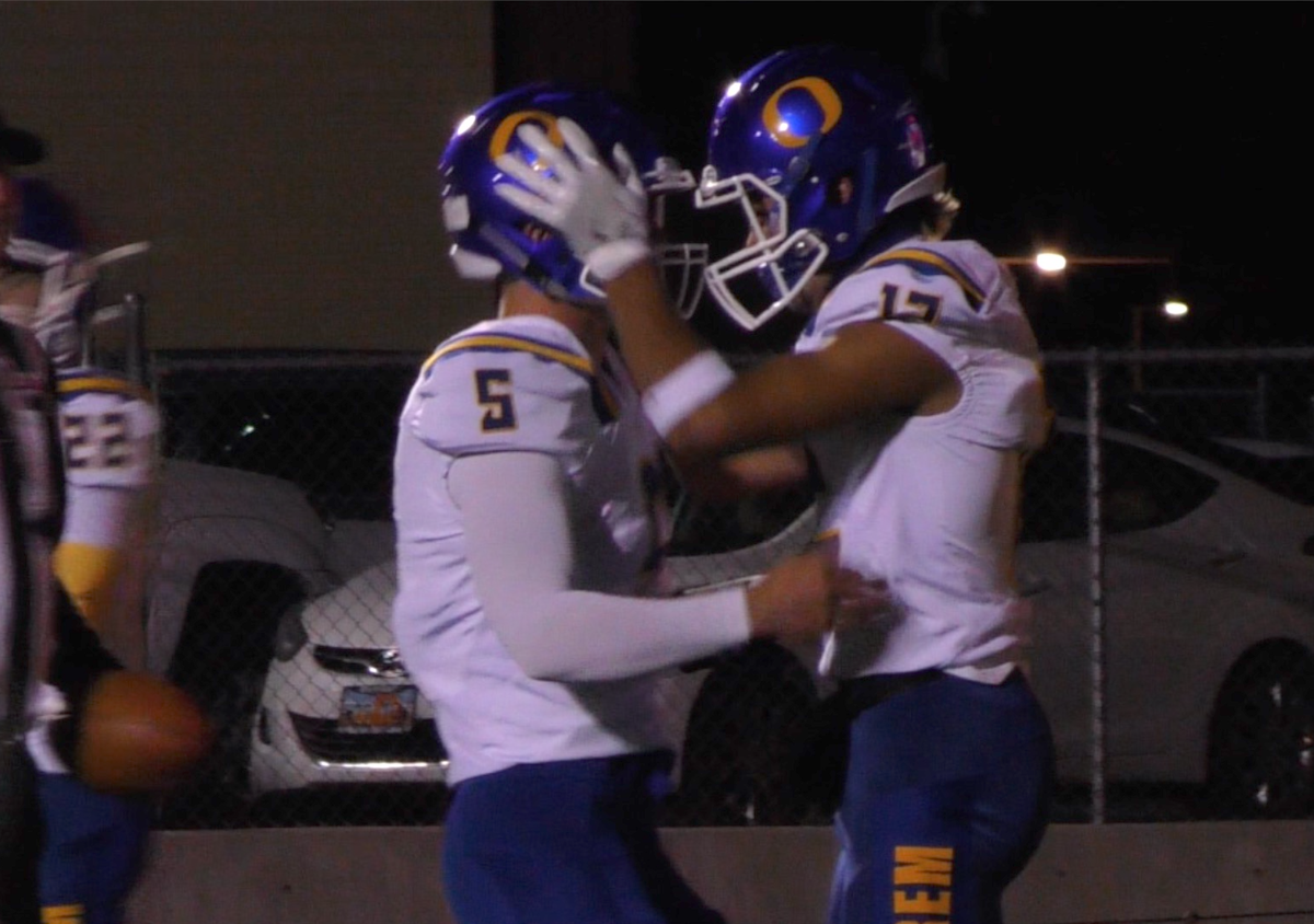 Orem's Puka Nacua (12) hugs his quarterback Cooper Legas after scoring a touchdown during the Tigers' 59-26 win over Spanish Fork, Friday, Oct. 17, 2018 in Spanish Fork, Utah. (Photo: Brandon Judd, Deseret News)
