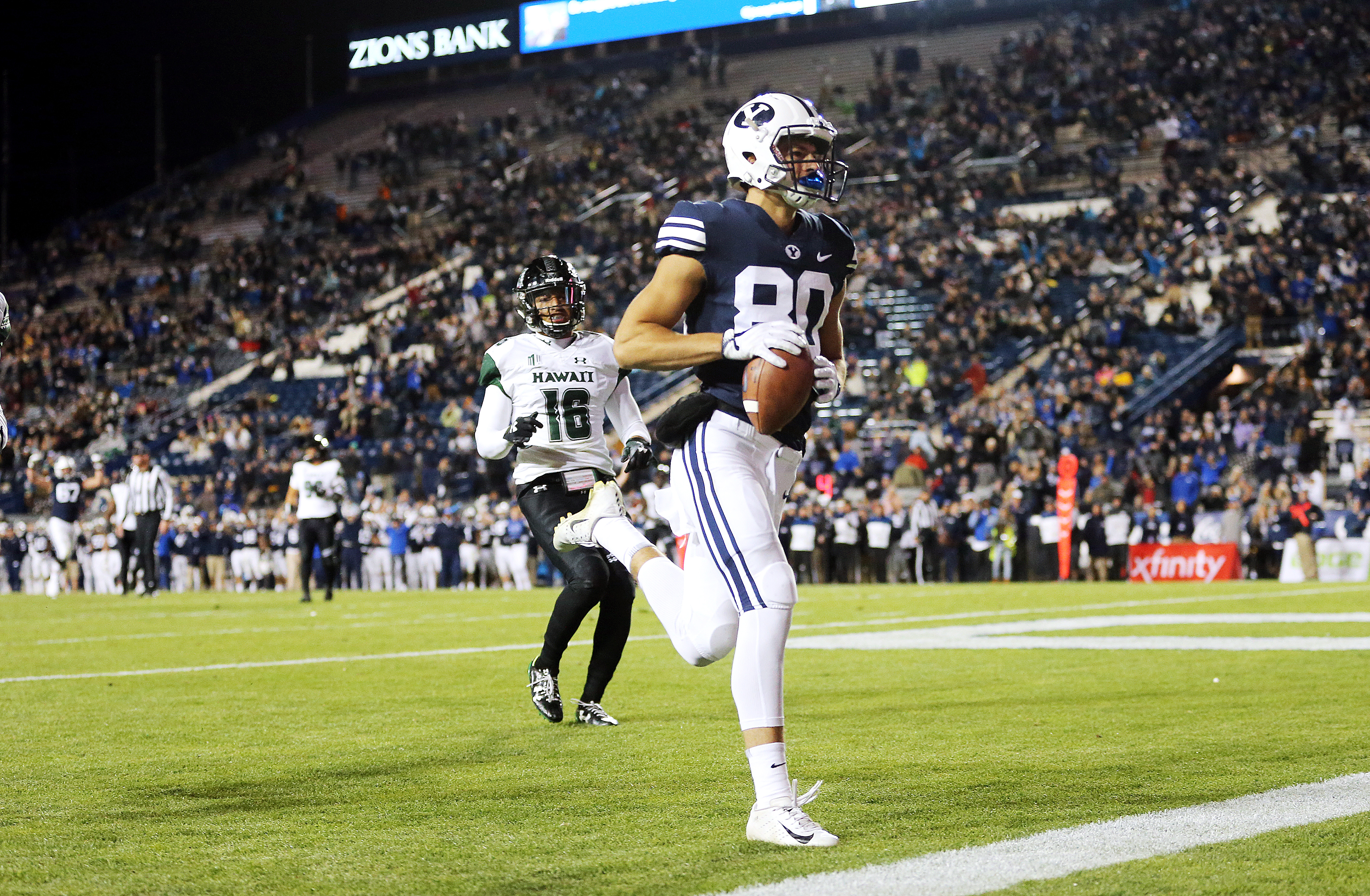BYU wide receiver Gunner Romney (80) runs out the back of the end zone after catching a pass for a touchdown as BYU and Hawaii play at LaVell Edwards Stadium in Provo on Saturday, Oct. 13, 2018. (Photo: Scott G Winterton, Deseret News)