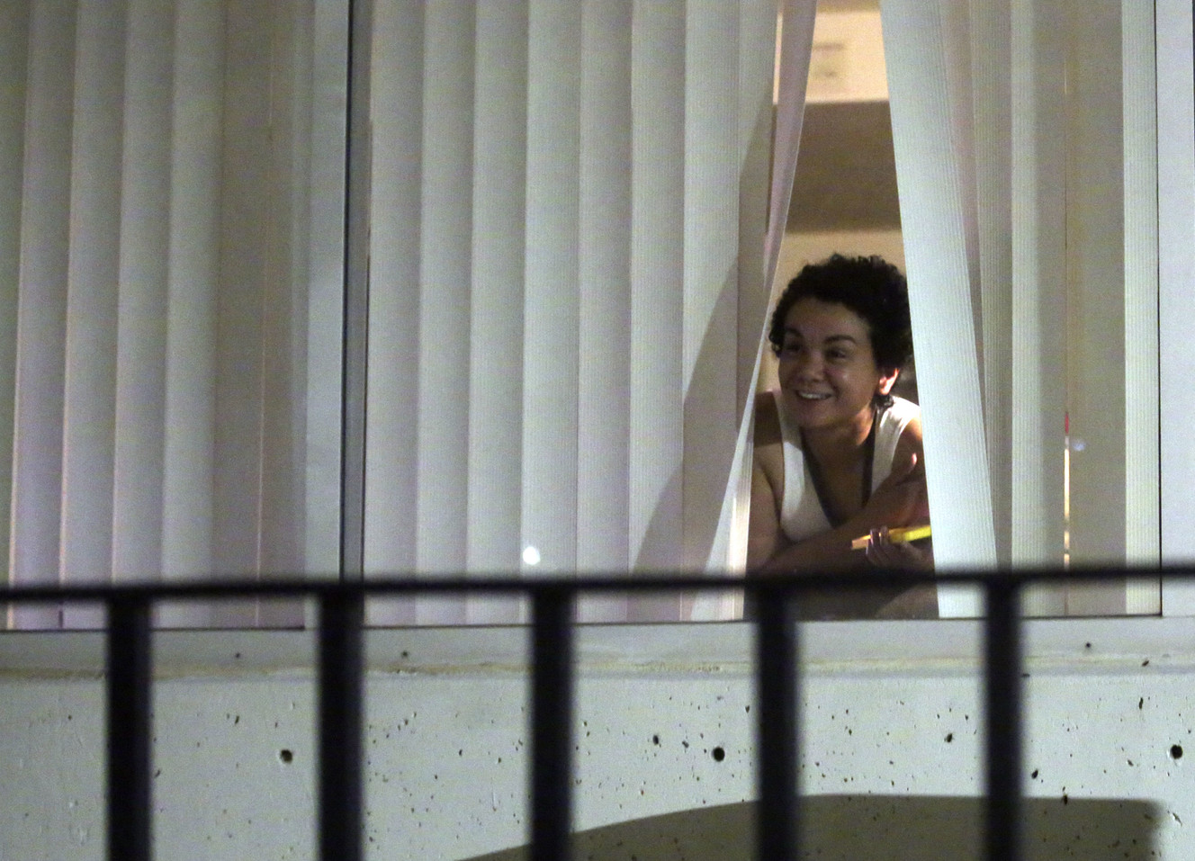 A young woman looks out a window of the South Medical Tower as students and staff are instructed to shelter in place while police look for a shooting suspect on the University of Utah campus in Salt Lake City on Monday, Oct. 22, 2018. (Photo: Kristin Murphy, KSL)