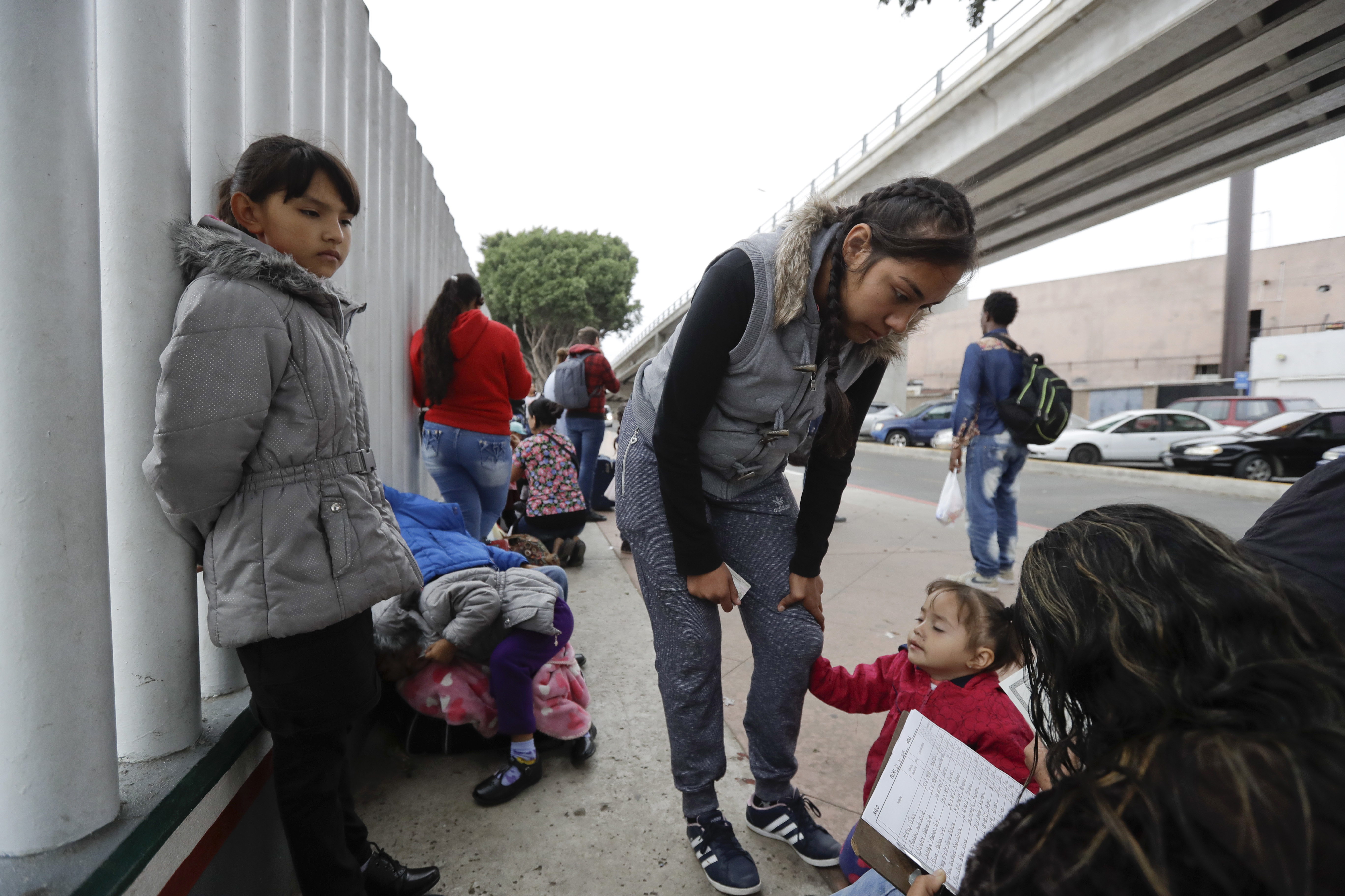 Long odds and slow lines await migrant caravan at US border