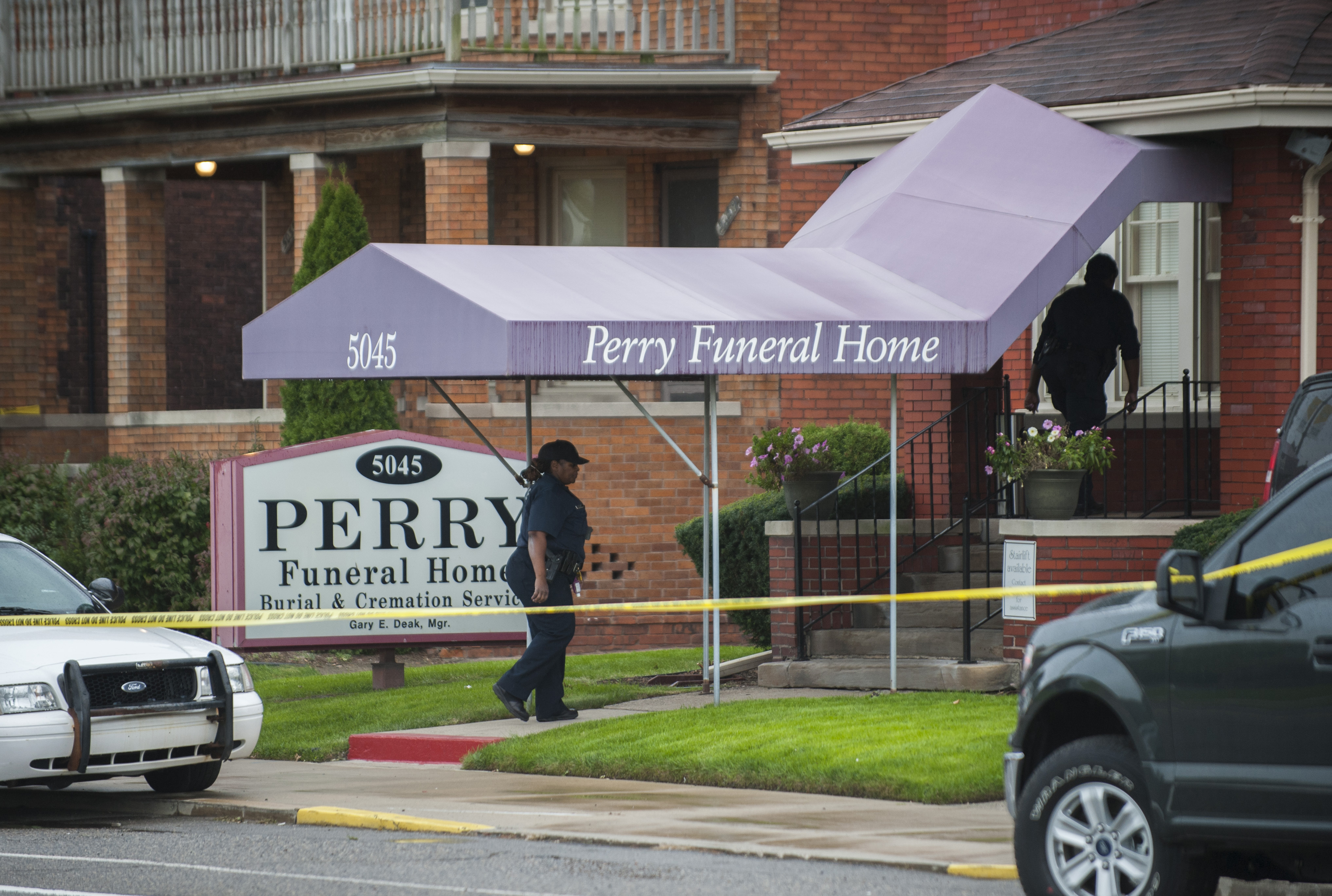 The Latest: Cremains given police escort to funeral home