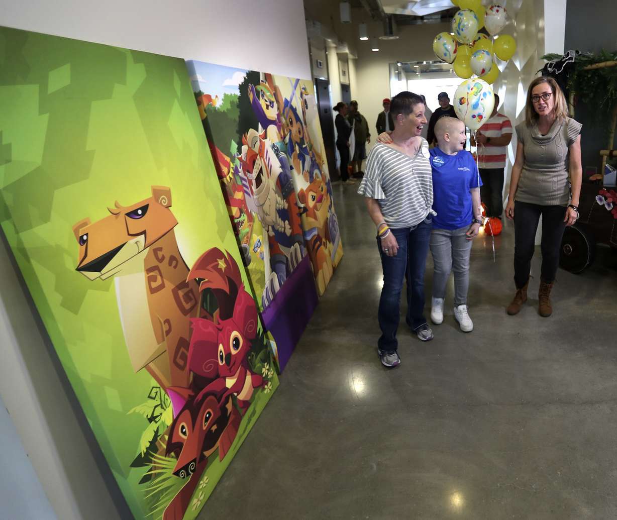 Kelly Moeller, left, and her daughter, Meagyn Moeller, 12, center, chat with Joy Gowans, of WildWorks, during a visit to the game development studio's offices in Draper on Thursday, Oct. 25, 2018. (Photo: Steve Griffin, KSL)