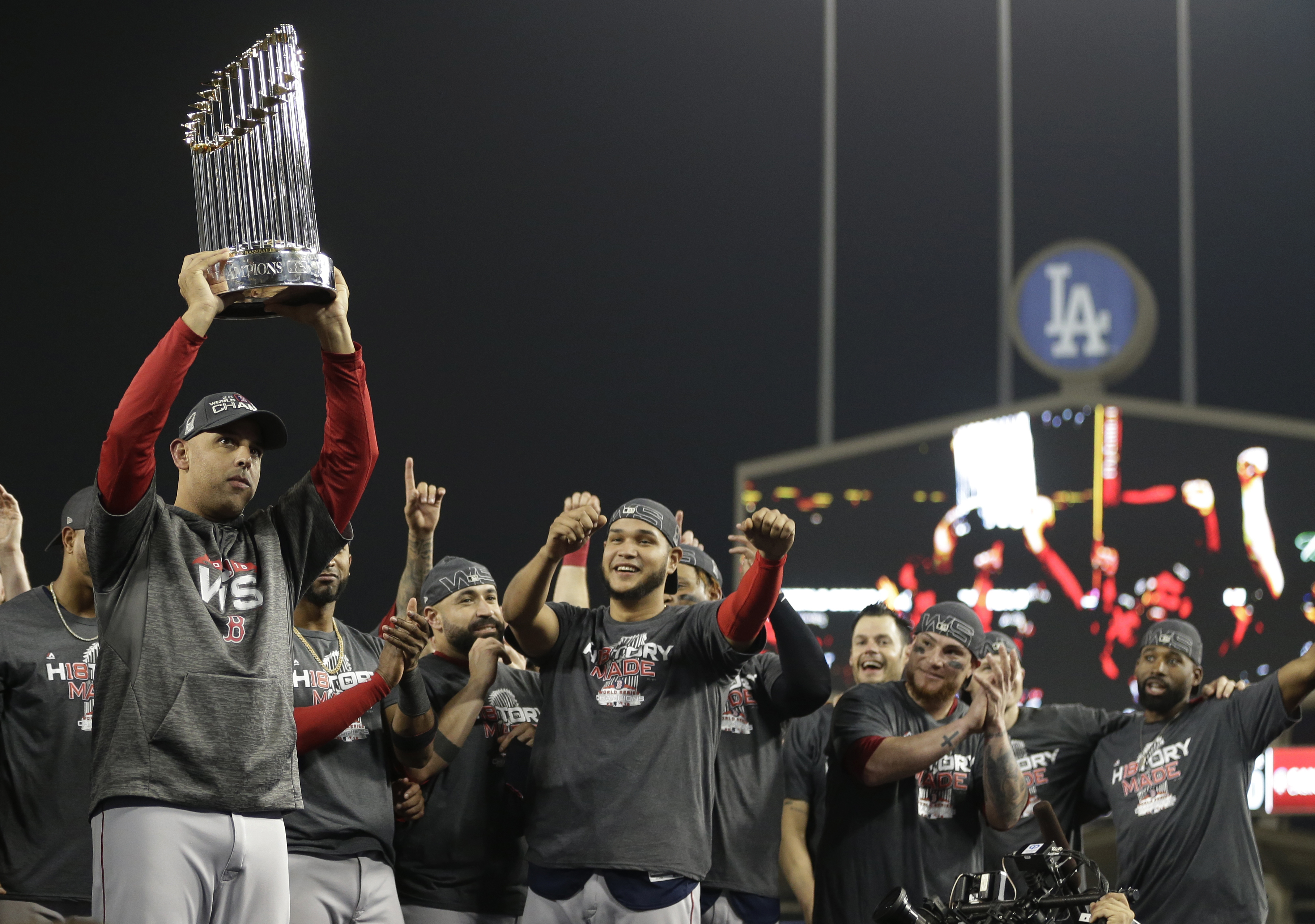 Boston Red Sox manager Alex Cora holds the championship trophy after Game 5 of baseball's World Series against the Los Angeles Dodgers on Sunday, Oct. 28, 2018, in Los Angeles. The Red Sox won 5-1 to win the series 4 game to 1. (Photo: David J. Phillip, AP)
