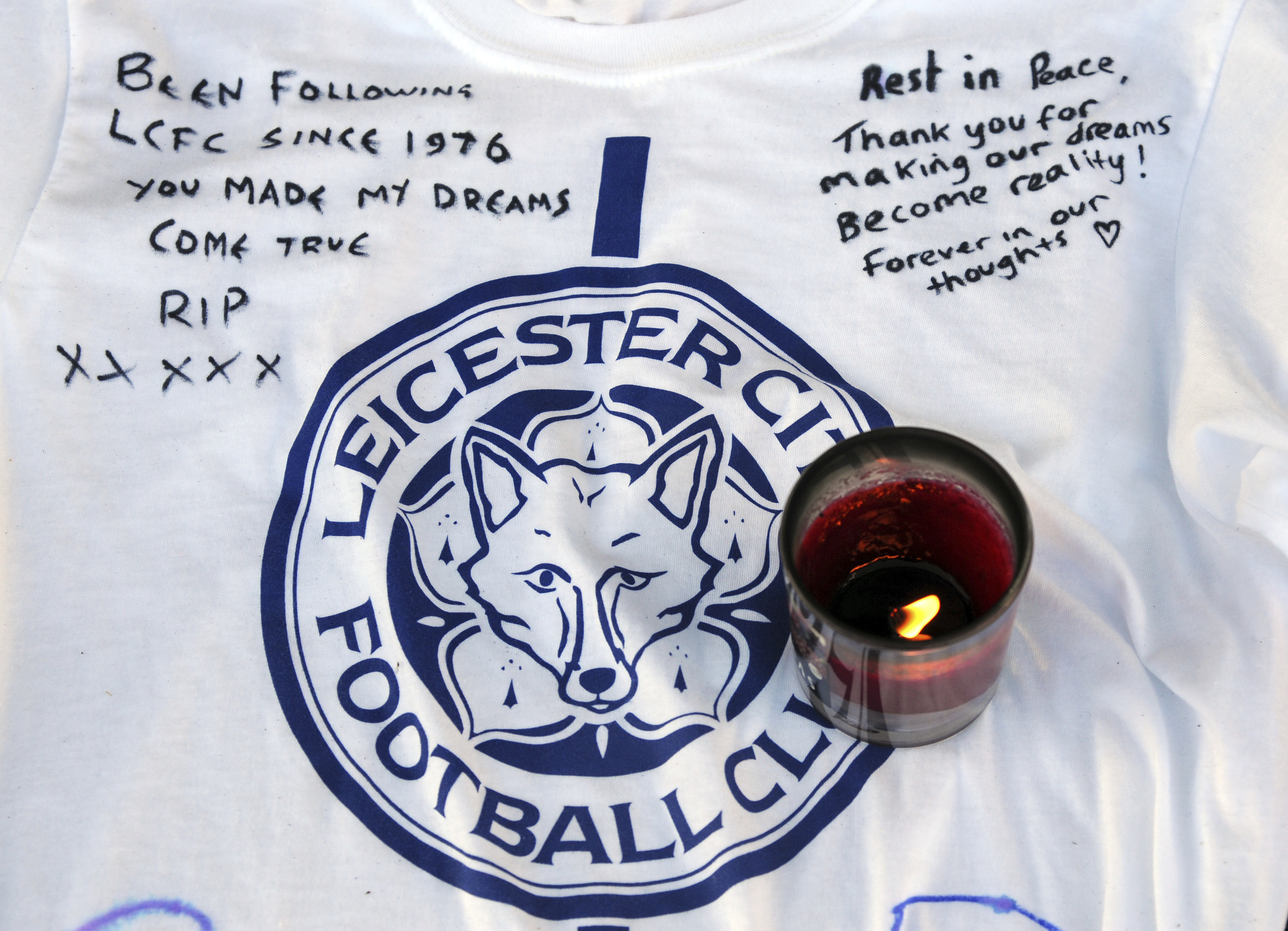 The Latest: Leicester players visit memorial to Thai owner