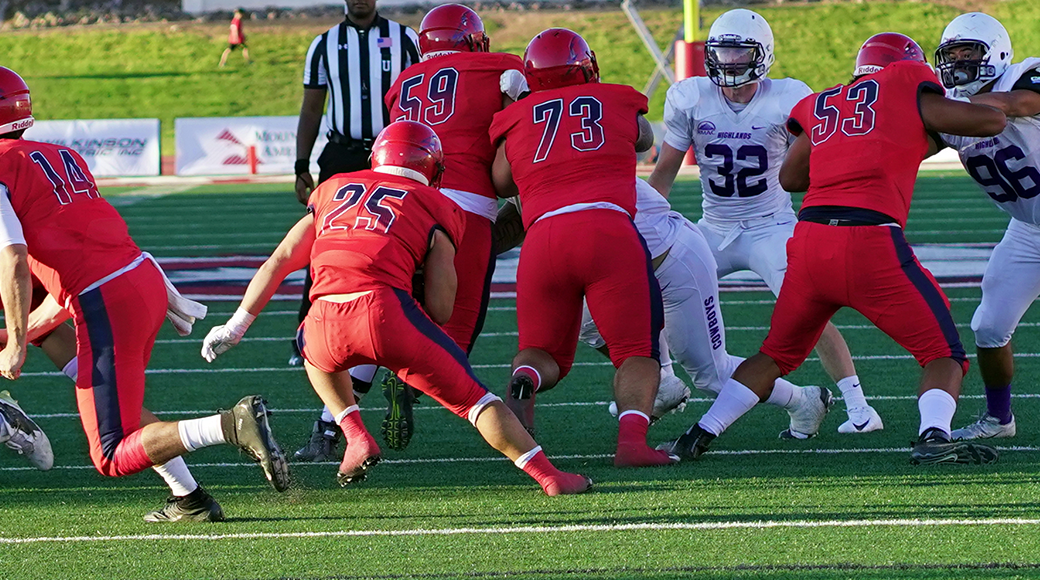 Dixie State running back Sei-J Lauago (25) during a game against New Mexico Highlands earlier this year. Dixie State has conducted a feasibility study to determine a potential move to NCAA Division I, with eyes on joining the Western Athletic Conference. (Photo: Stan Plewe, Dixie State Athletics)