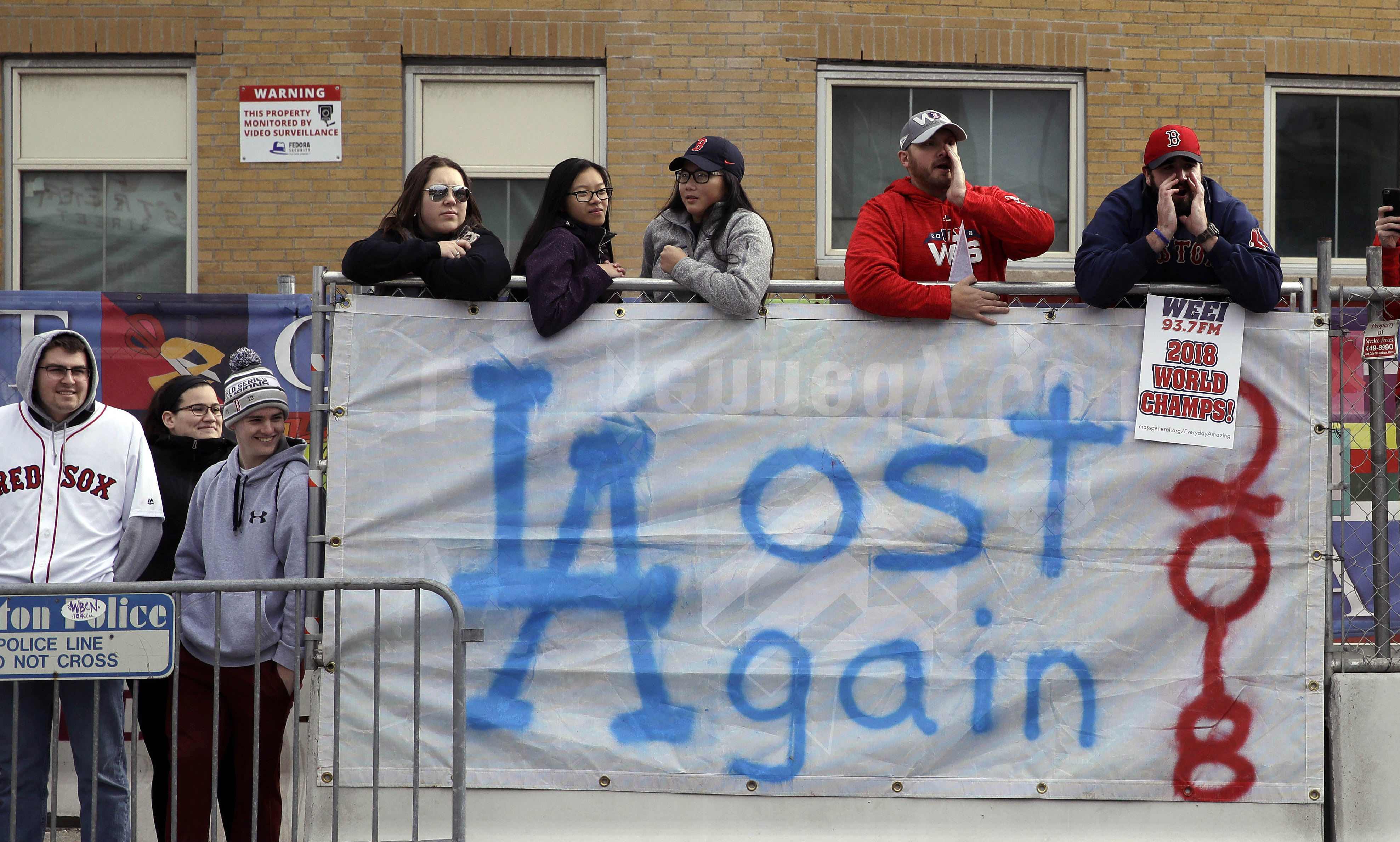 The Latest: Sox manager, trophy hit by beer cans at parade