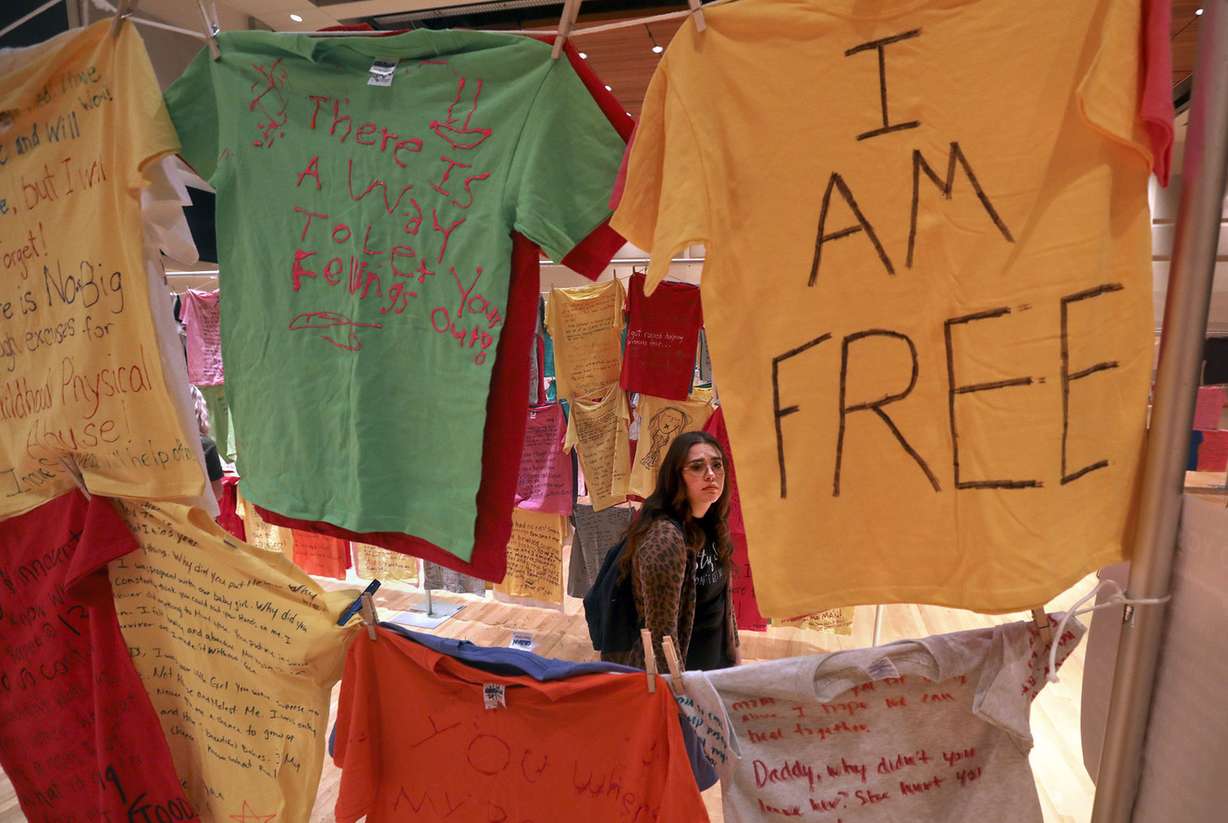 Jaidy Warner walks through the Clothesline Project at Utah Valley University in Orem on Wednesday, Oct. 31, 2018. (Photo: Kristin Murphy, KSL)