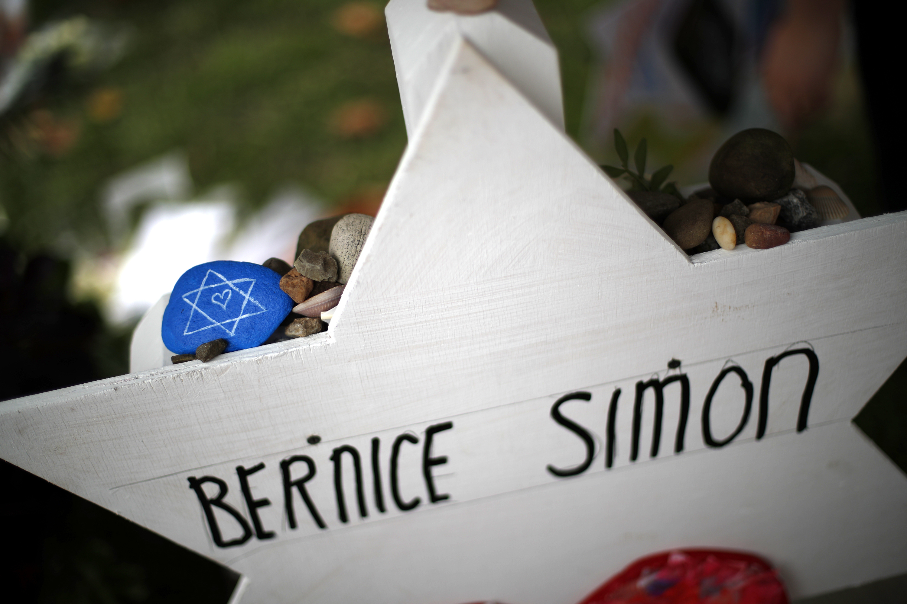 Synagogue suspect pleads not guilty as funerals continue