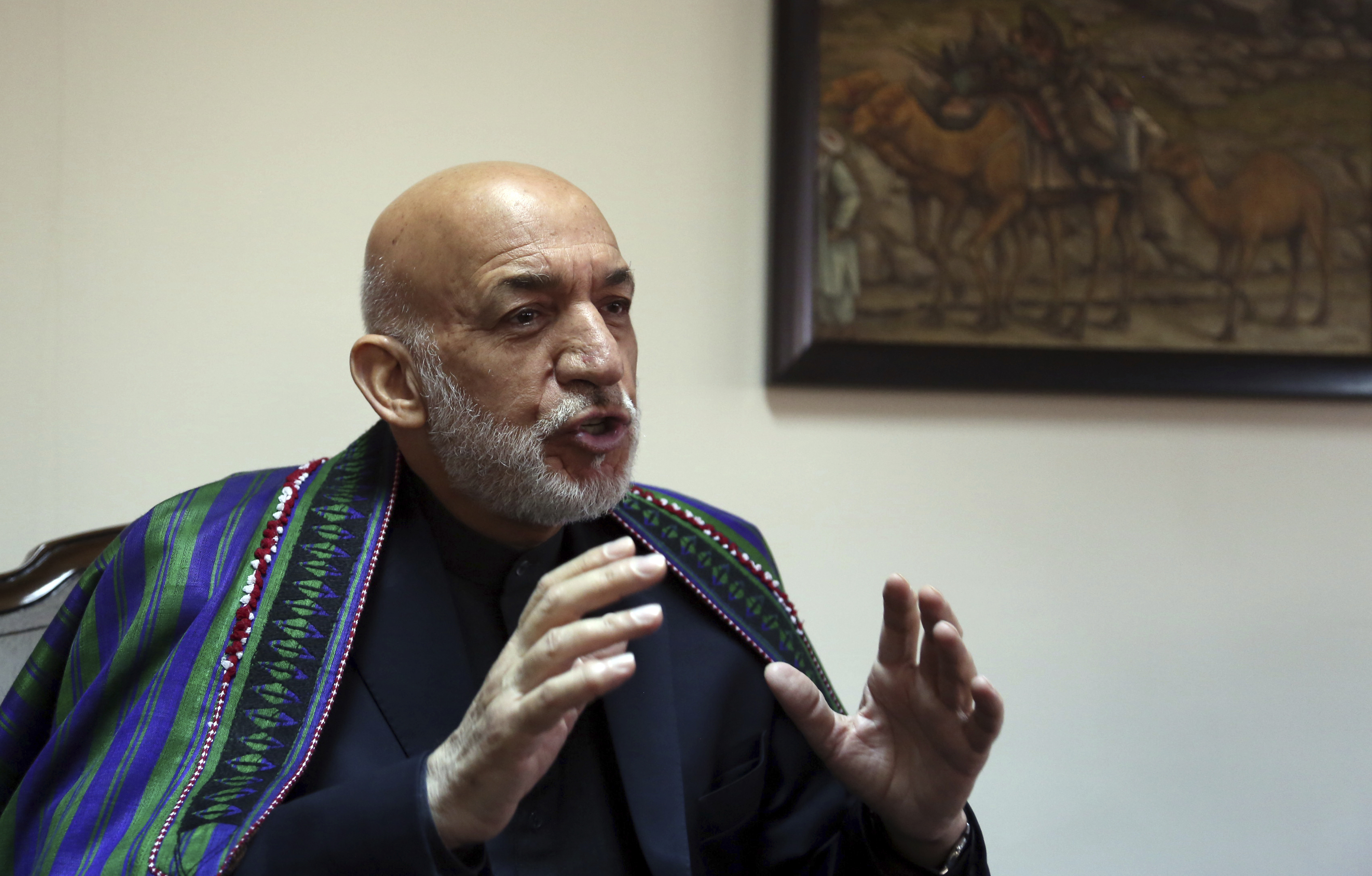 AP Interview: Karzai welcomes Gitmo 5 into peace discussion