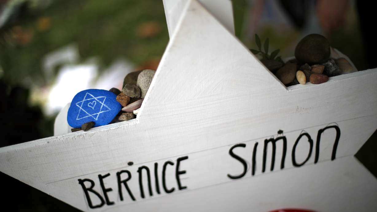 The Latest: Funeral held for couple slain in synagogue