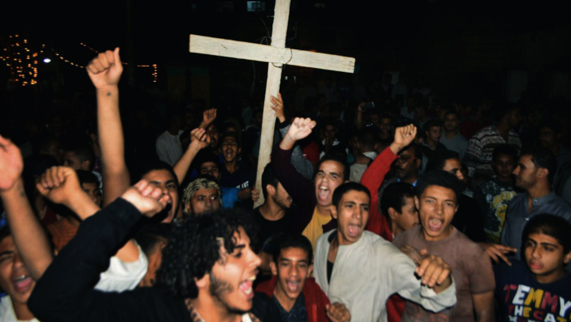 Christians in Egypt bury their dead after attack