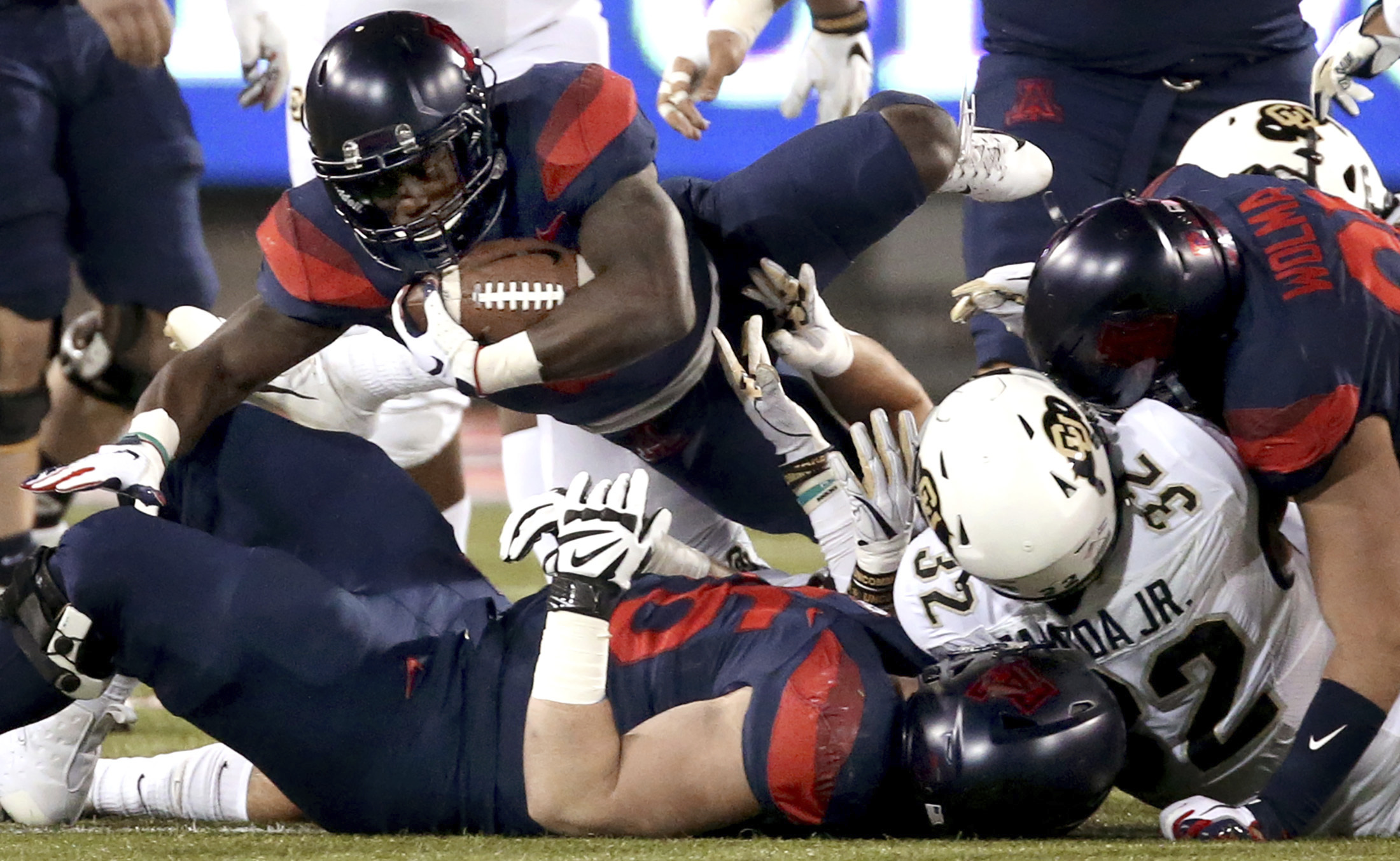 Tate's 5 TD passes lead Arizona to 42-34 win over Colorado