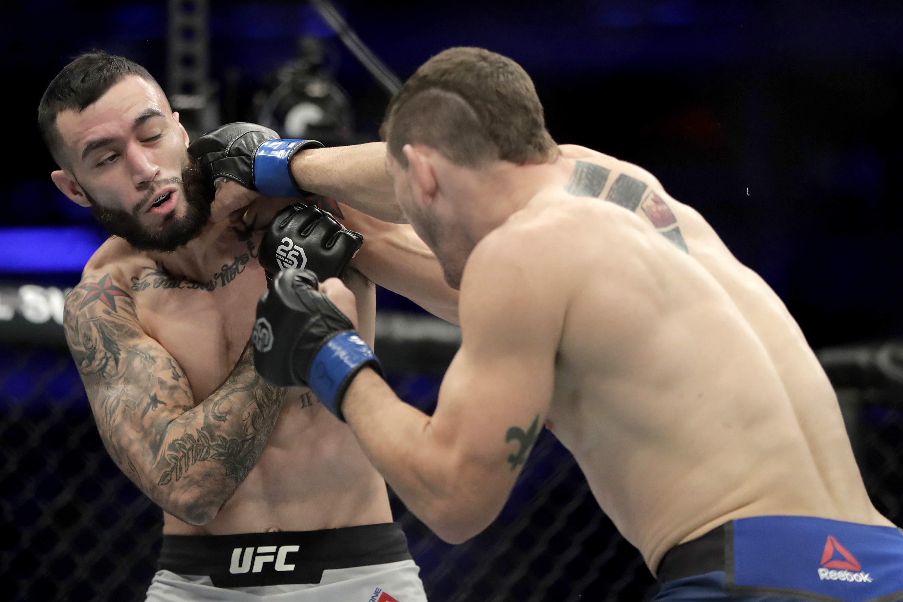 Cormier chokes out Lewis; defends 2nd title at UFC 230