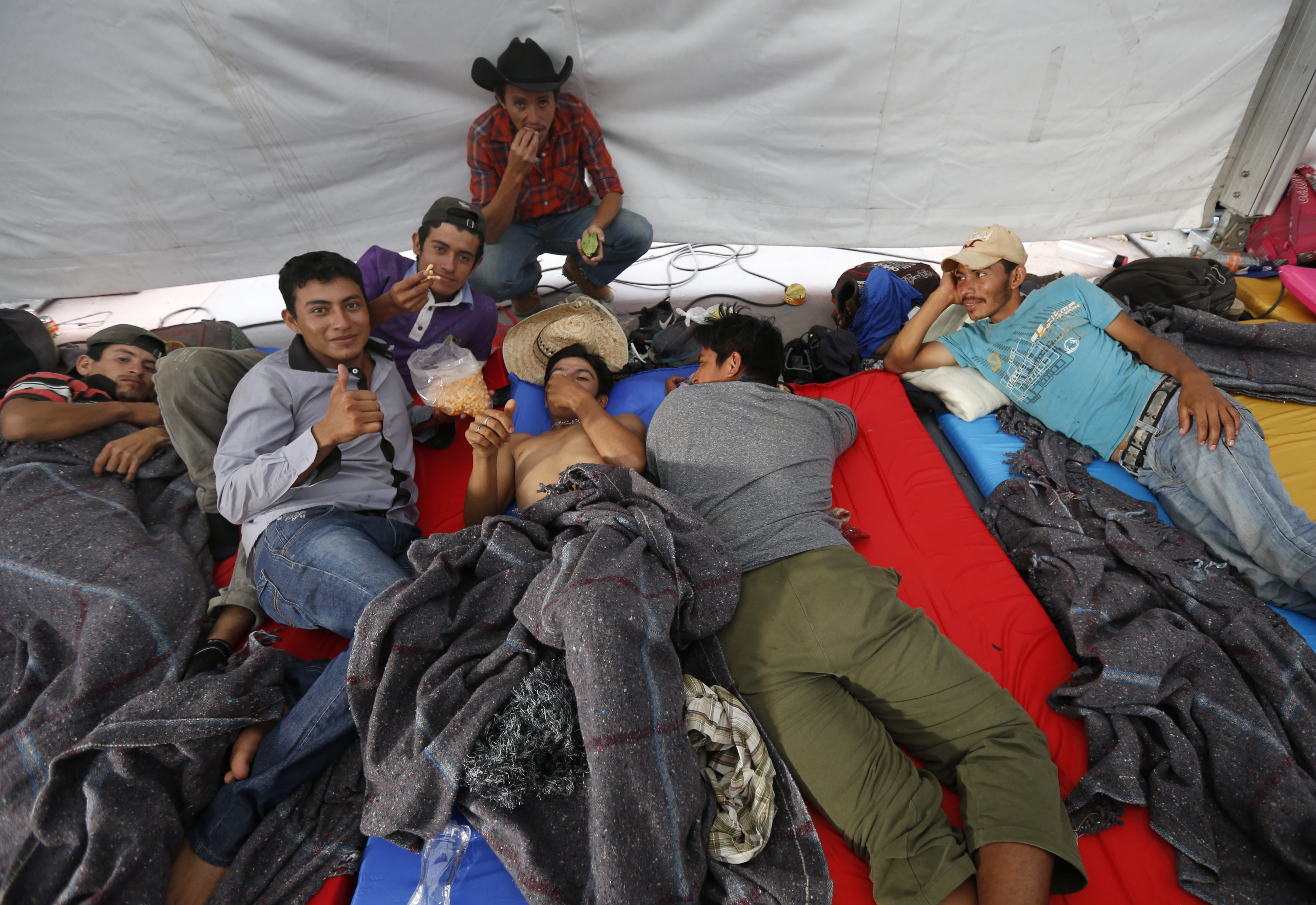 The Latest: Aid workers help migrants at Mexico City stadium