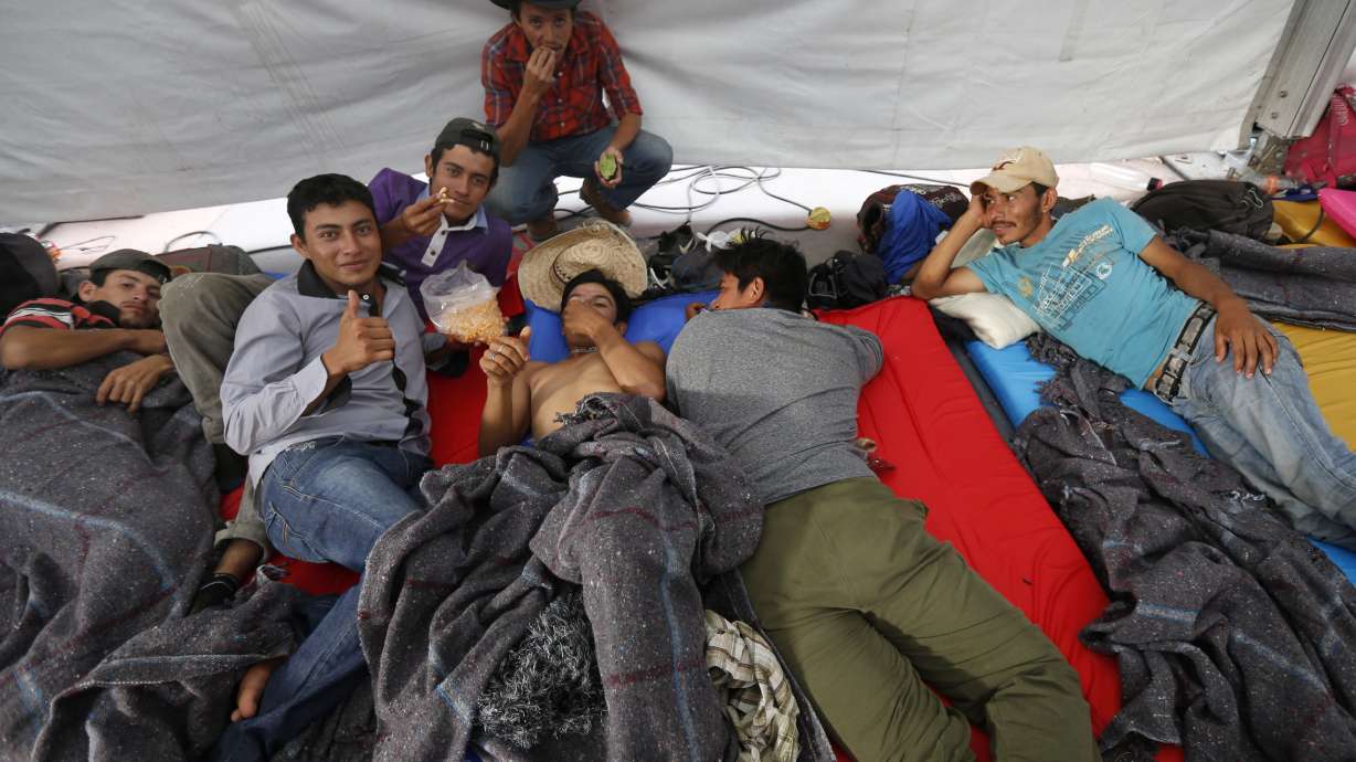 The Latest: Aid workers help migrants at Mexico City stadium