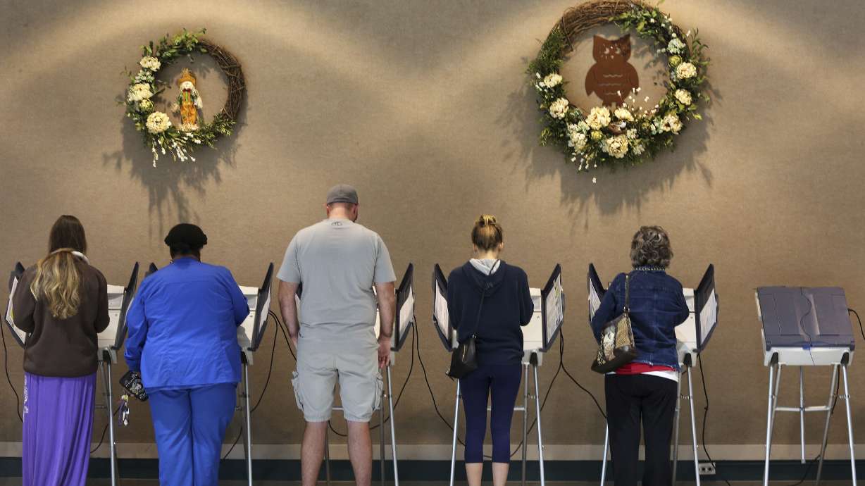 AP VoteCast: Trump a dominant force on voters' minds