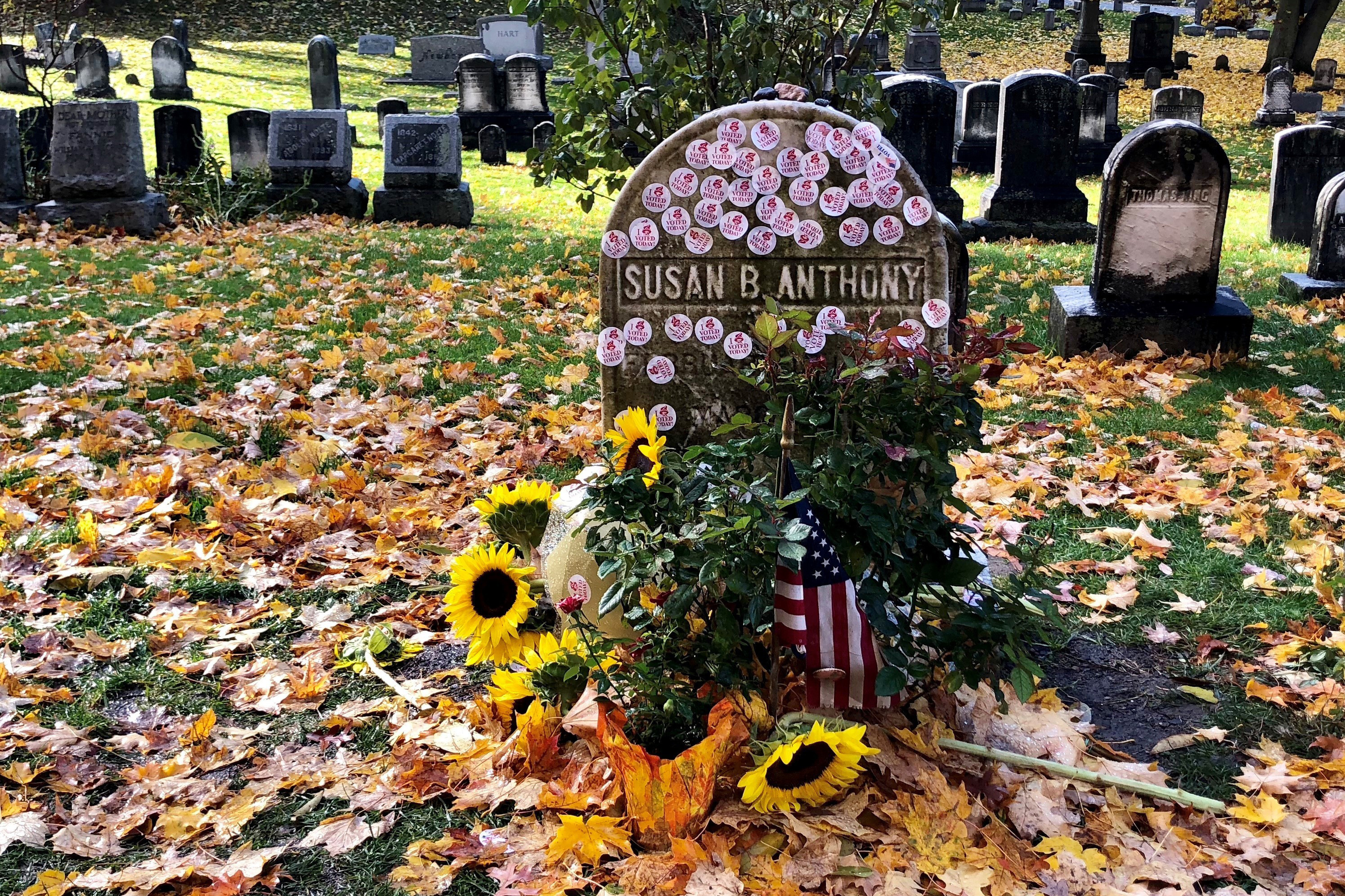 Susan B. Anthony's grave decorated with 'I Voted' stickers