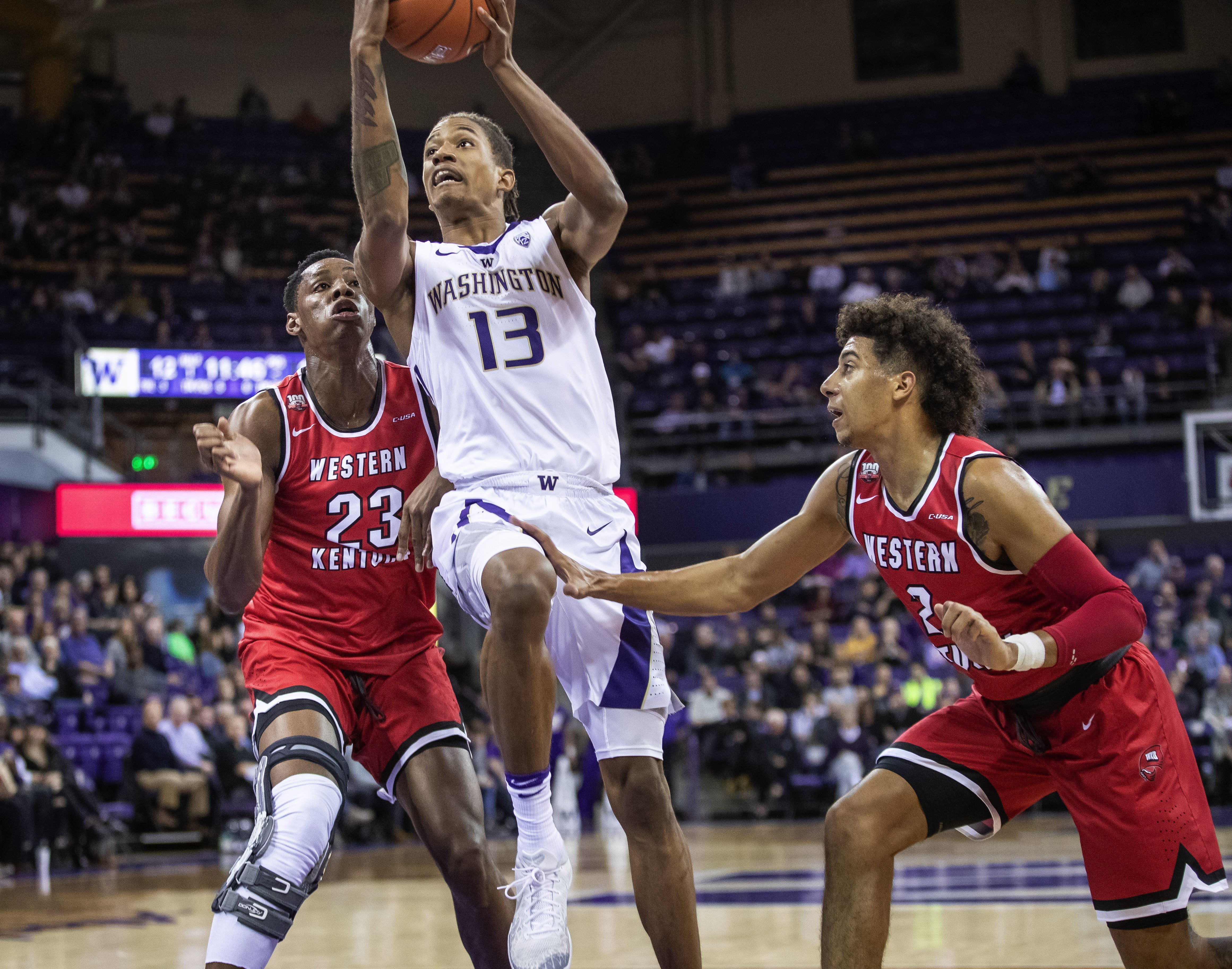Dickerson lifts No. 25 Washington past W. Kentucky 73-55
