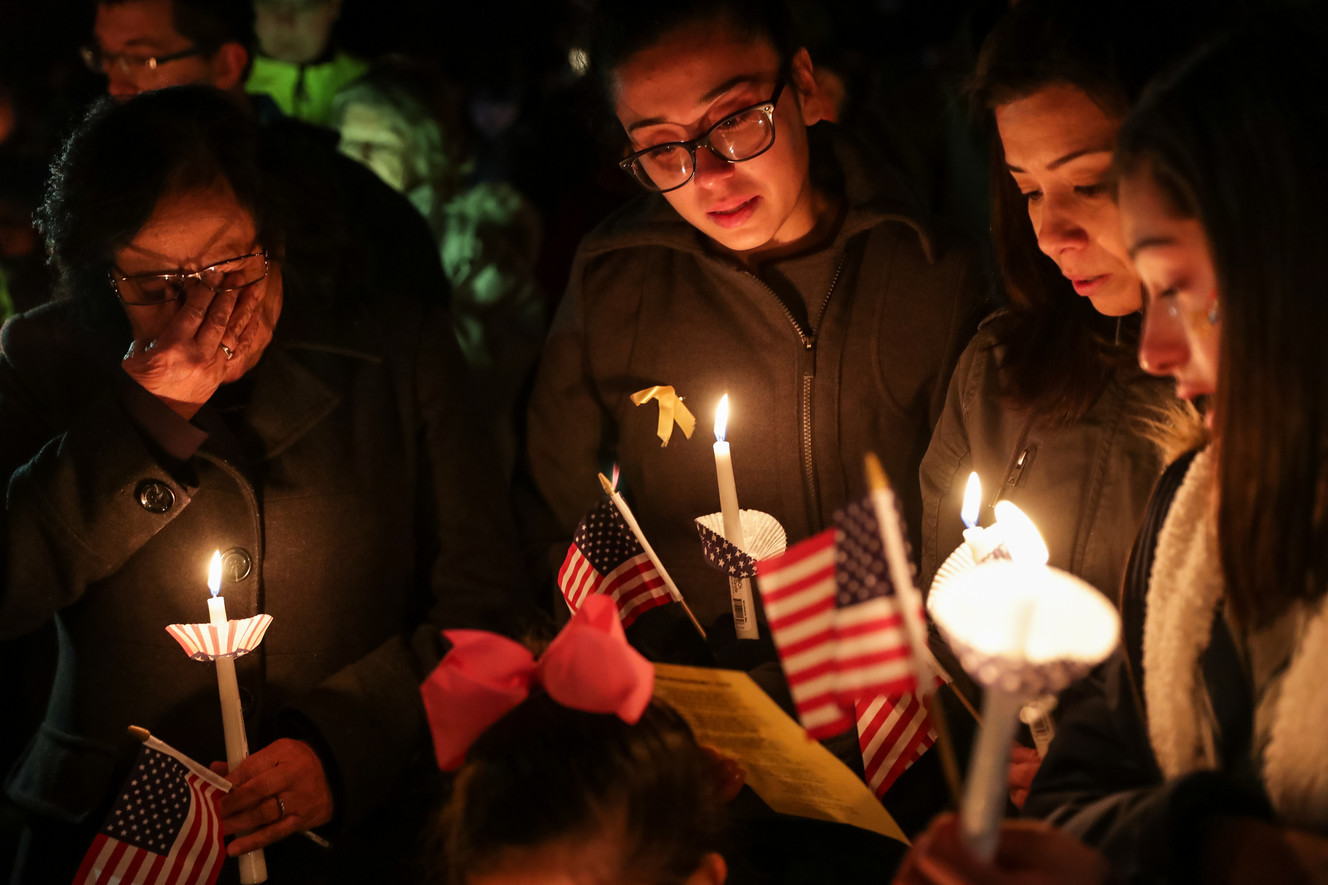 The family of Pedro Barboza Flores stands together at a vigil honoring Maj. Brent Taylor outside his home in North Ogden on Wednesday, Nov. 7, 2018. Taylor, mayor of North Ogden and a major in the Utah Army National Guard, was killed in Afghanistan on Saturday. Flores was killed in Afghanistan in 2009. From left is Aurora Barboza, Karina, Barboza, Mayra Barboza and Mia Barboza. (Photo: Spenser Heaps, KSL)