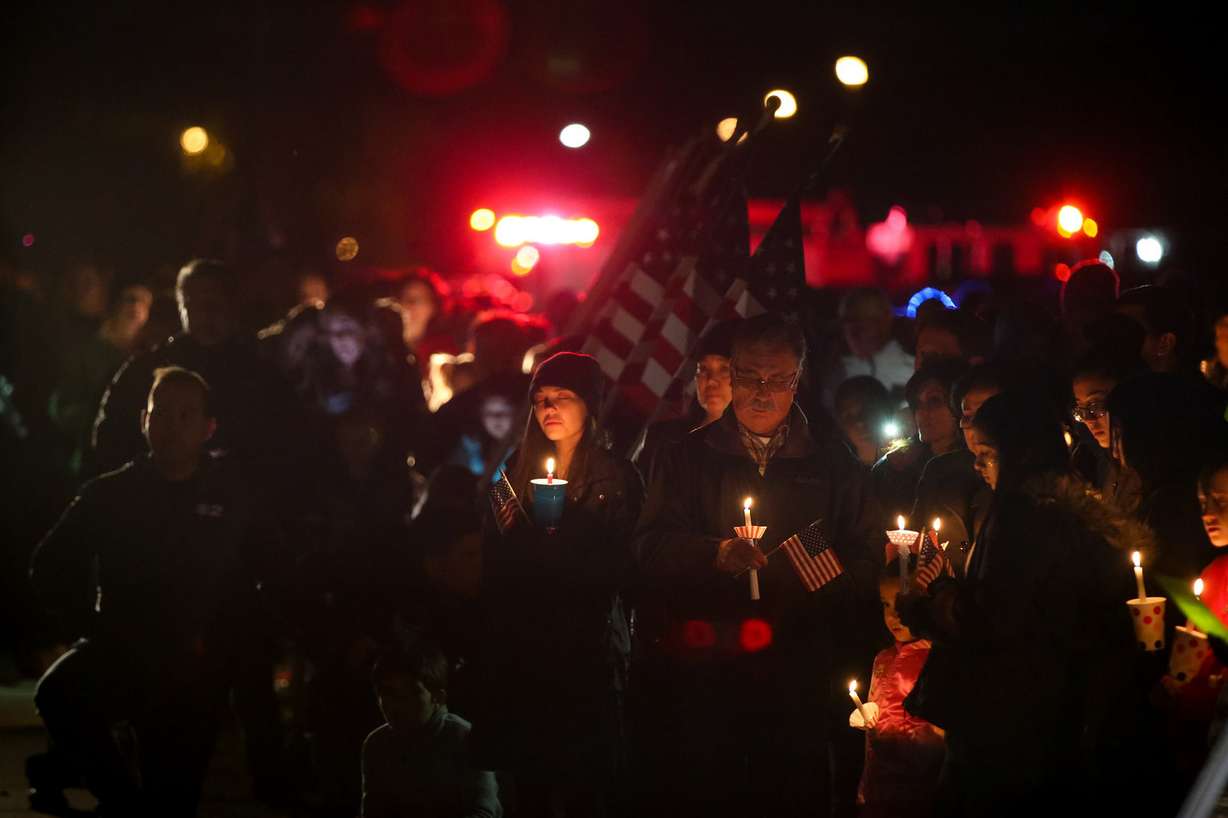 People gather for a vigil honoring Maj. Brent Taylor outside his home in North Ogden on Wednesday, Nov. 7, 2018. Taylor, mayor of North Ogden and a major in the Utah Army National Guard, was killed in Afghanistan on Saturday. (Photo: Spenser Heaps, KSL)
