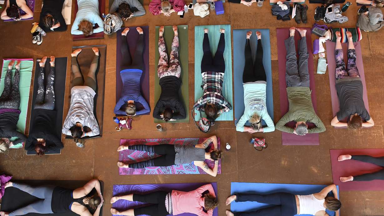 More US adults and kids are doing yoga, meditating