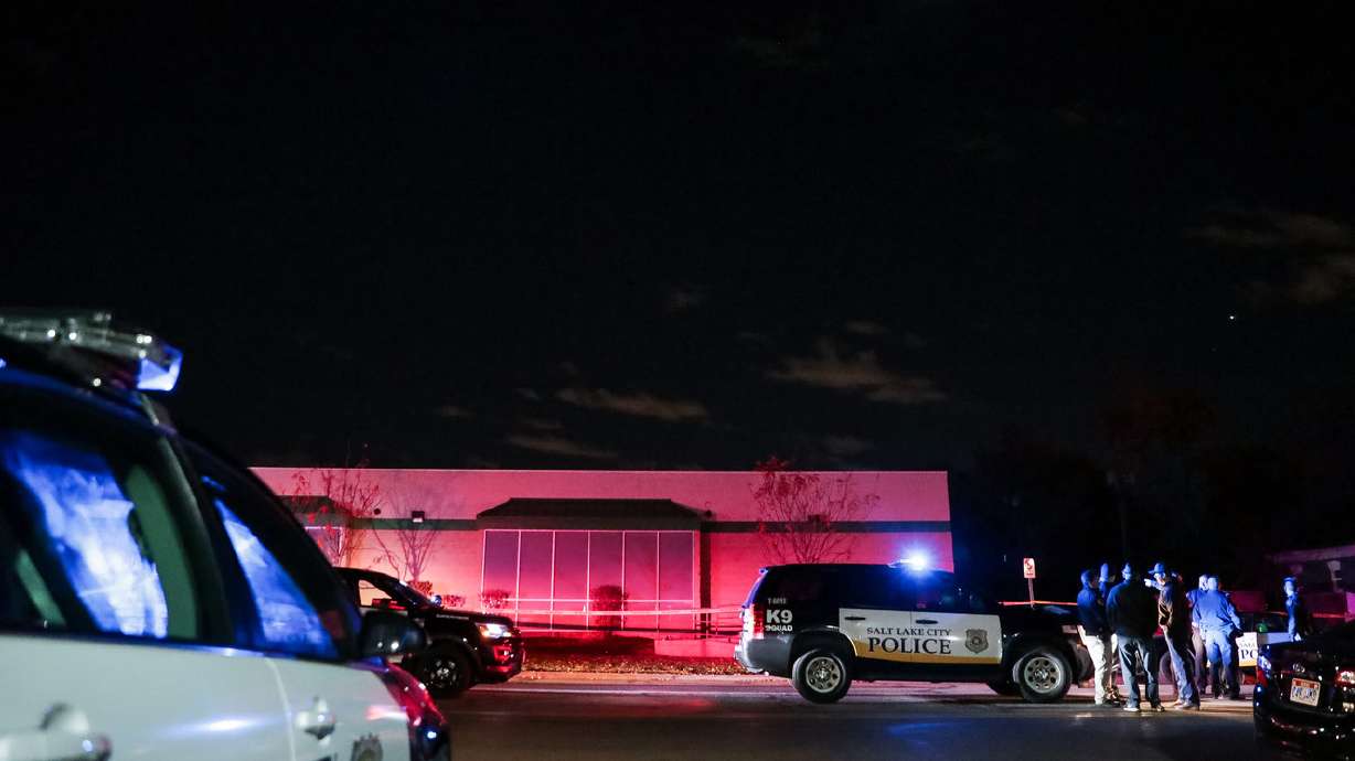 A police helicopter circles overhead as police work the scene of a stabbing that left a woman dead and another man critically injured at 477 N. 300 West in Salt Lake City on Nov. 7, 2018. Police arrested a man Monday in the killing.