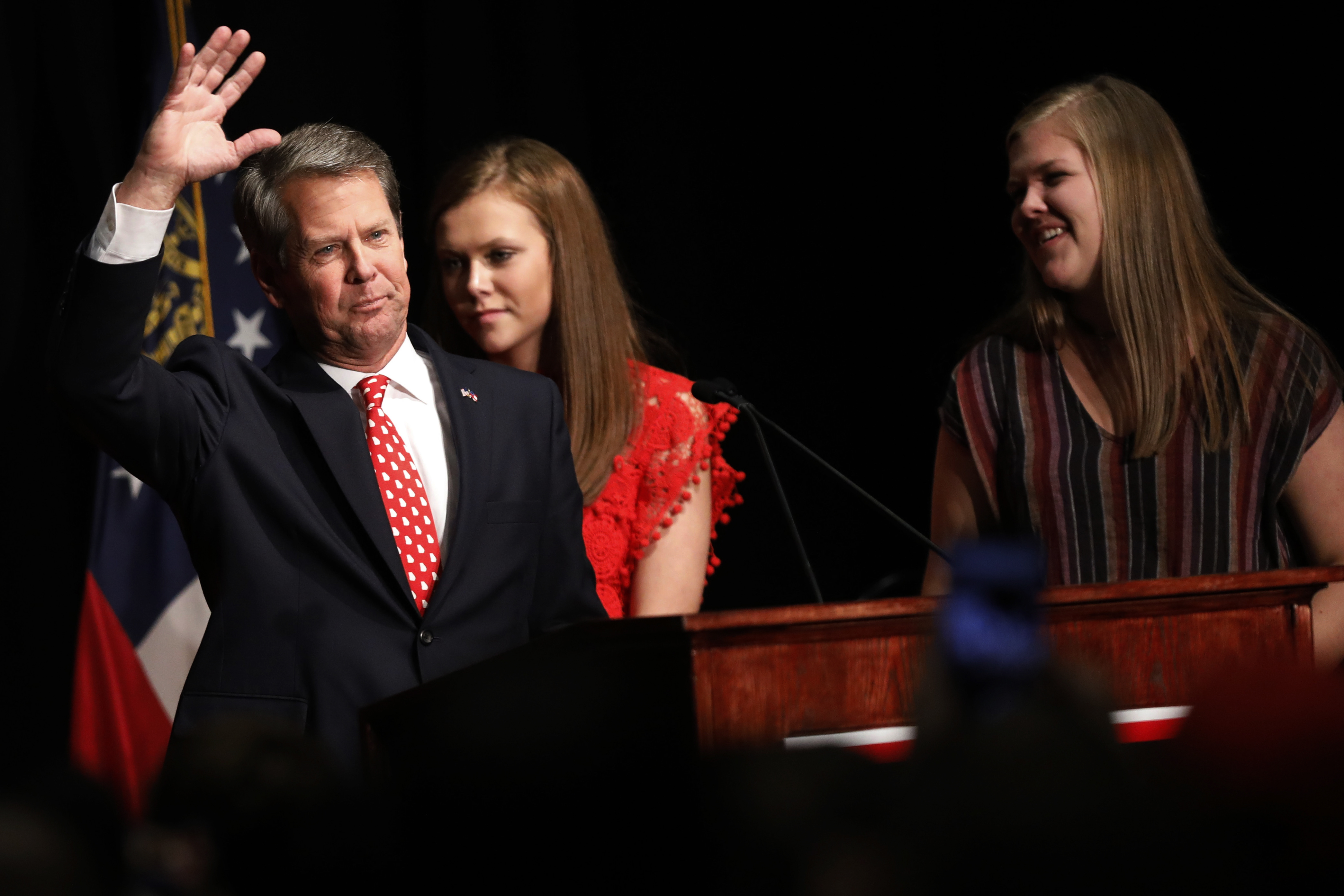 Georgia's Kemp says he's governor-elect, Abrams fights on