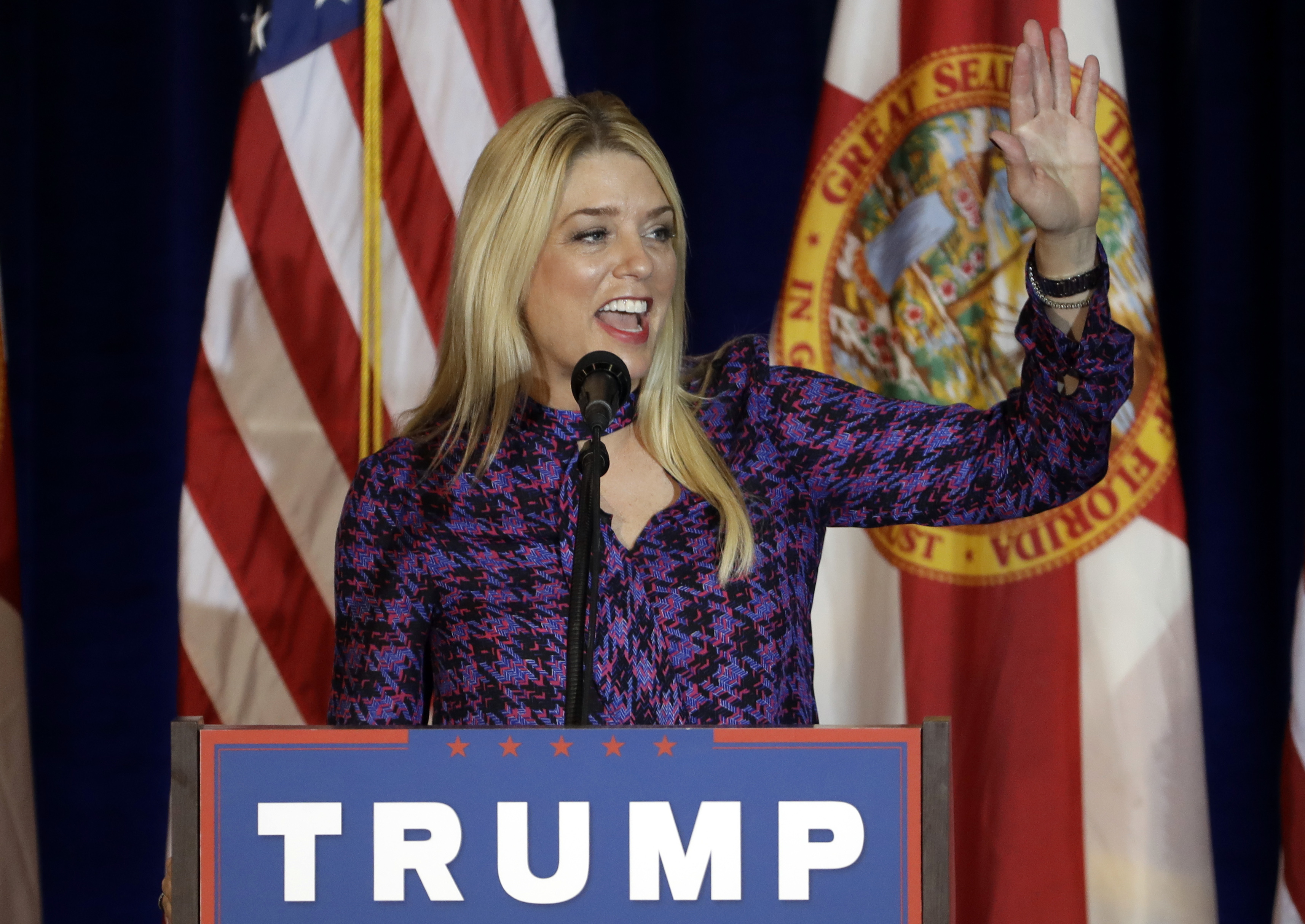 FILE - In this Nov. 5, 2016, file photo, Florida Attorney General Pam Bondi waves as she speaks at a campaign stop for Republican presidential candidate Donald Trump in Tampa, Fla. (AP Photo/Chris O'Meara, File)
