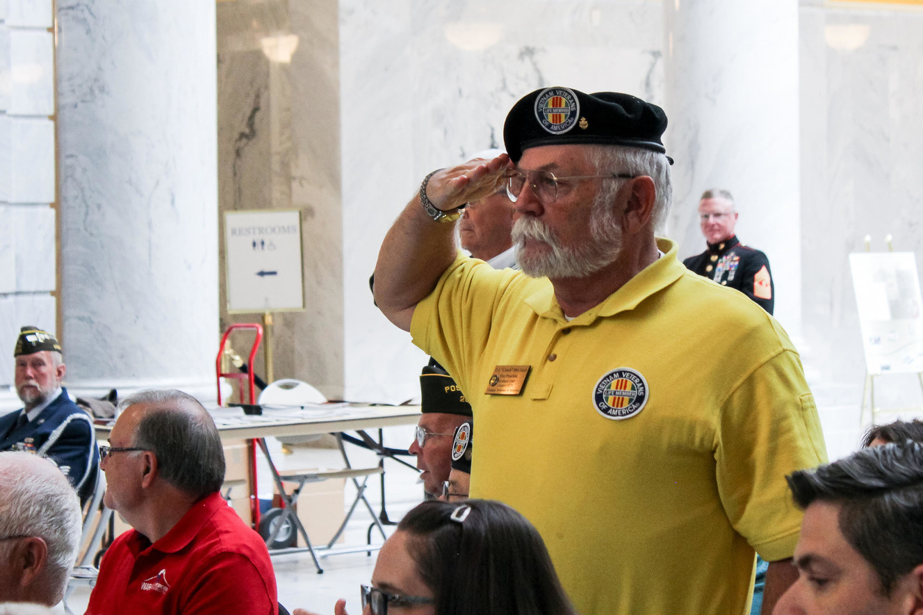 U.S. Navy veteran Don McCoach stands as the Utah National Guard Brass Quartet plays the Armed Forces service songs at the Veterans Day Ceremony and World War I Armistice 100th Anniversary Commemoration Thursday, Nov. 8, 2018, at the Capitol in Salt Lake City. Photo: Spencer Burt, KSL