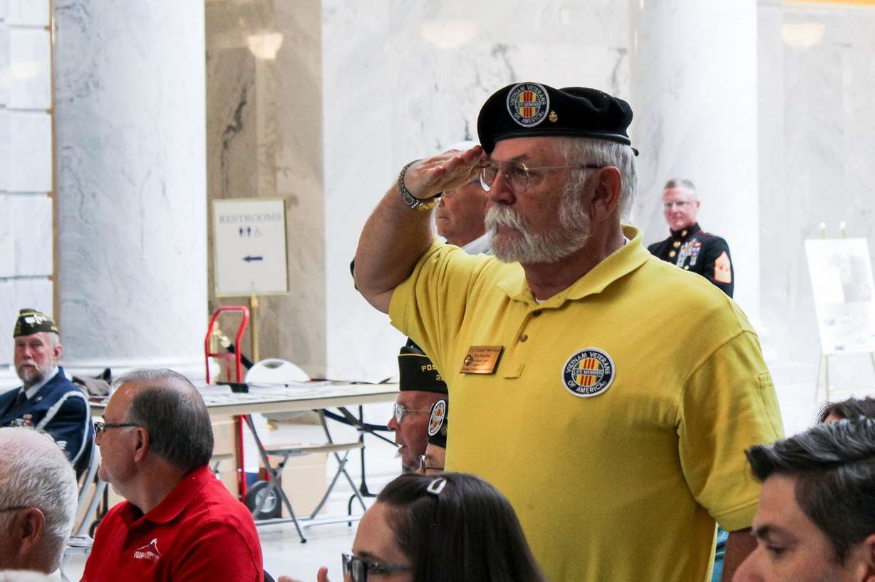 U.S. Navy veteran Don McCoach stands as the Utah National Guard Brass Quartet plays the Armed Forces service songs at the Veterans Day Ceremony and World War I Armistice 100th Anniversary Commemoration Thursday, Nov. 8, 2018, at the Capitol in Salt Lake City. Photo: Spencer Burt, KSL