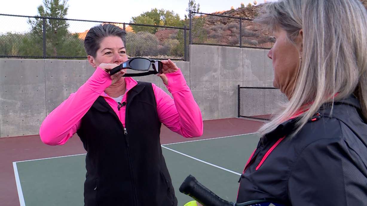 Di Shanklin shows her friend Julie Kanouse how strobe training glasses work. (Photo: KSL TV)