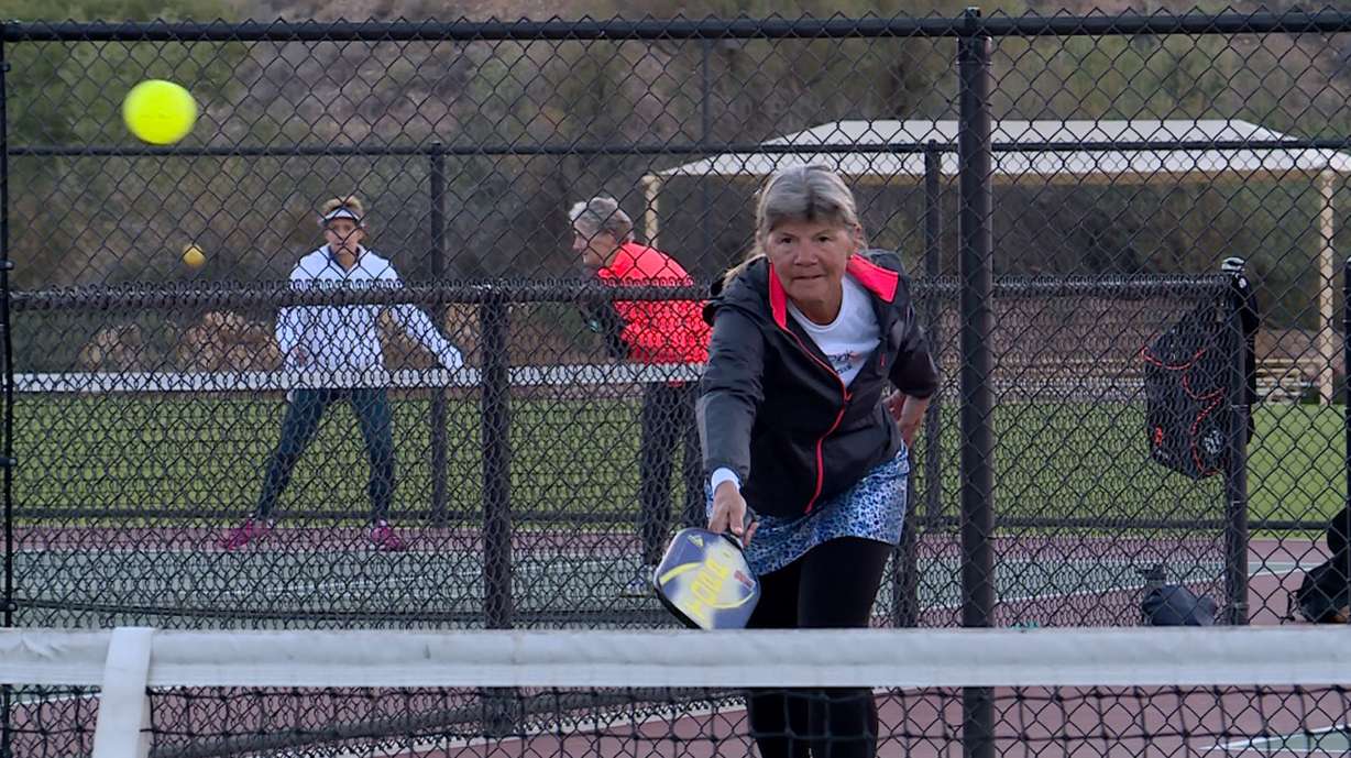 Julie Kanouse serves in a game of pickleball. (Photo: KSL TV)