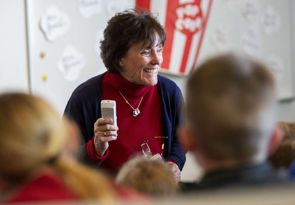 In this Monday, Oct. 29, 2018 photo, Librarian Kris Williams works with a class at Beaver School District's Belknap Elementary School in Beaver, Utah. The school is one of the highest performing elementary schools in Utah. (Scott G Winterton/The Deseret News via AP)