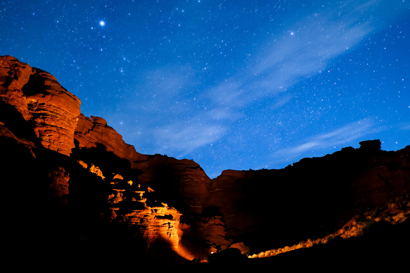 A campfire illuminates the surroundings under a starry sky in Lockhart Basin in San Juan County on Sunday, May 14, 2017. (Photo: Spenser Heaps, KSL)