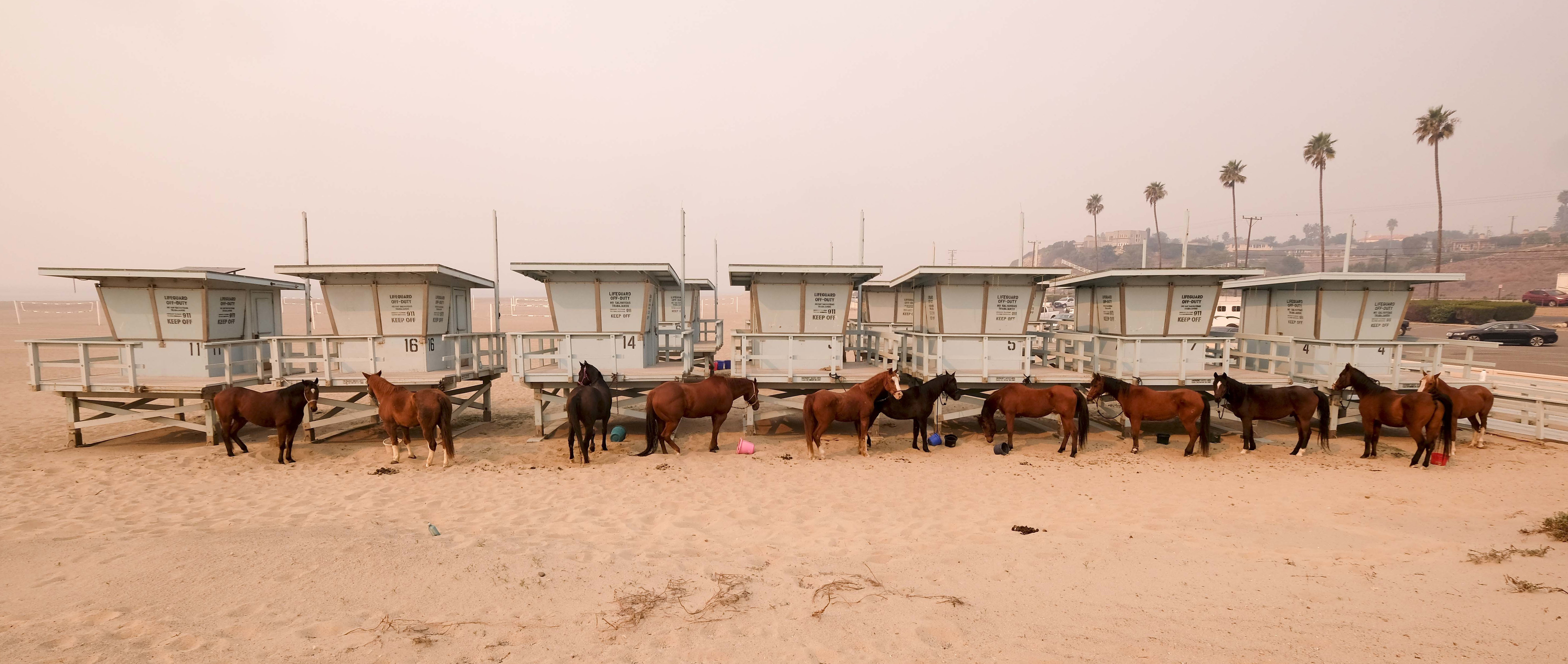 AP News Guide: Fires blaze on 2 ends of California, kill 25