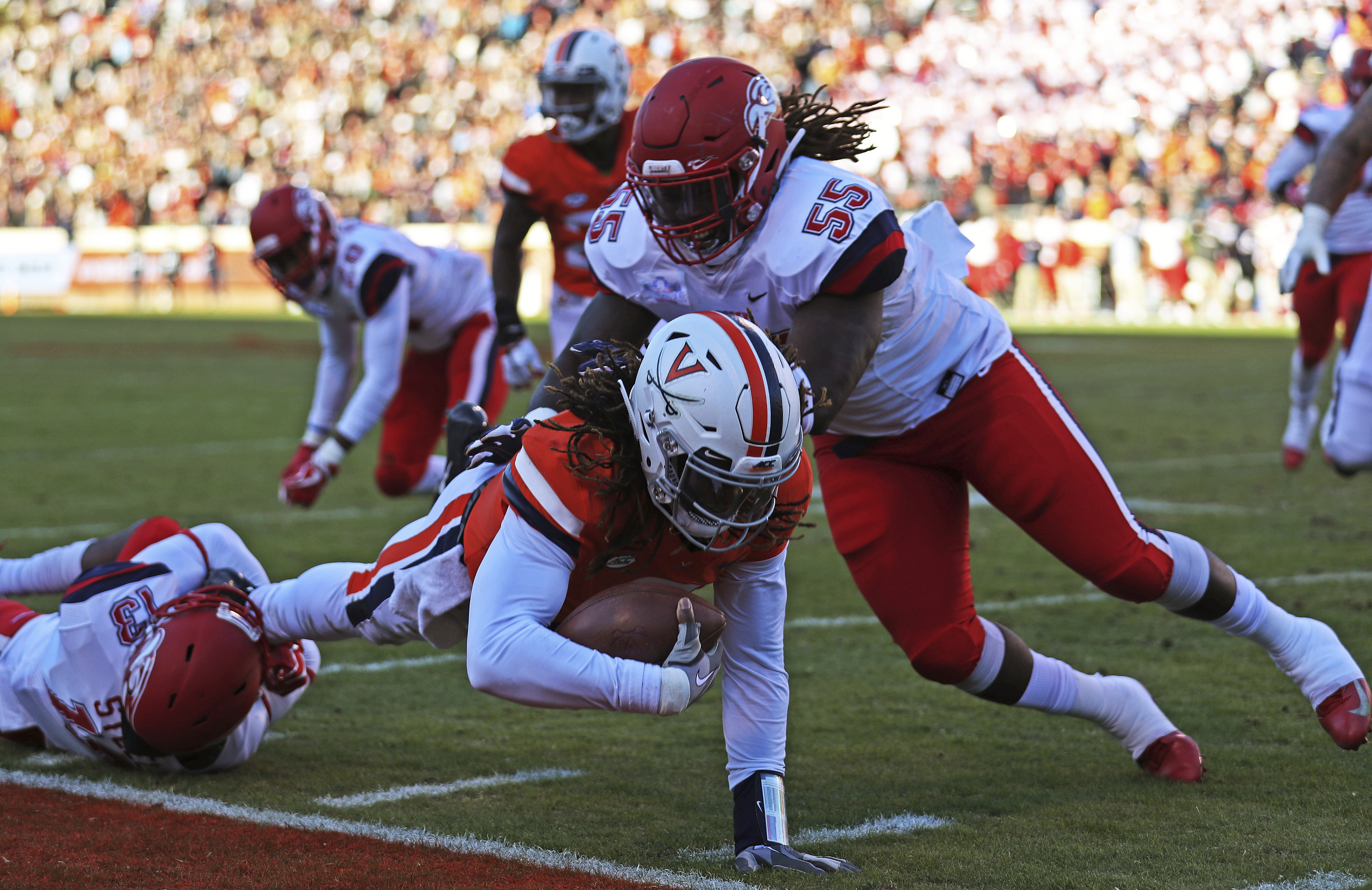 Perkins, Reed lead Virginia past Liberty, 45-24