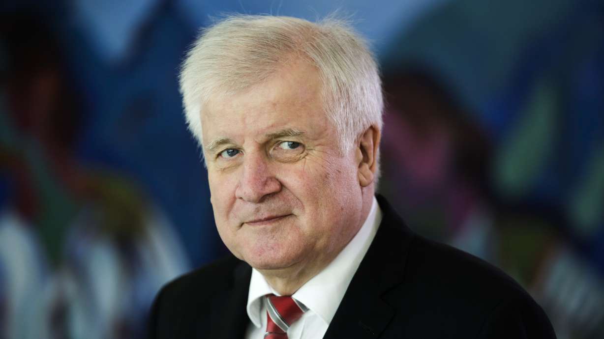 The Latest: Germany's Seehofer to remain interior minister