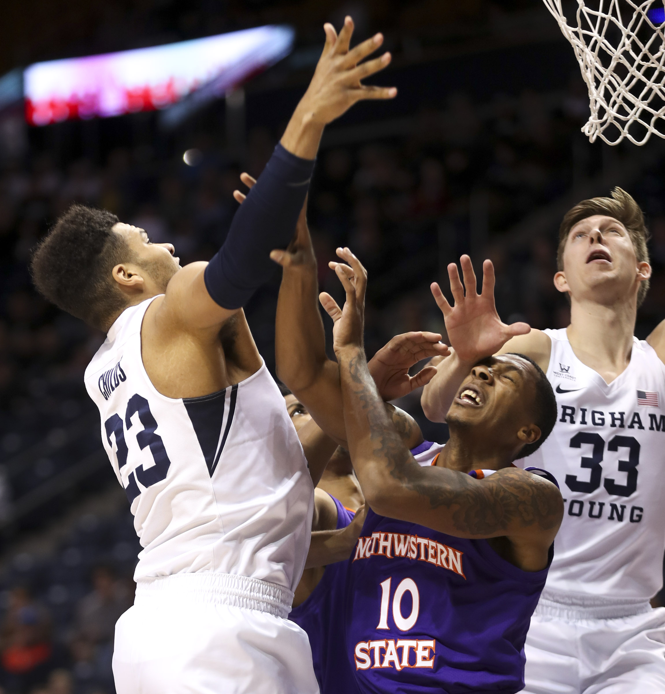 BYU forward Yoeli Childs (23) and forward Dalton Nixon (33) crash the boards against Northwestern State forward Malik Metoyer (10) during the BYU vs. Northwestern State basketball game at the Marriott Center in Provo on Tuesday, Nov. 13, 2018. (Photo: Steve Griffin, Deseret News)