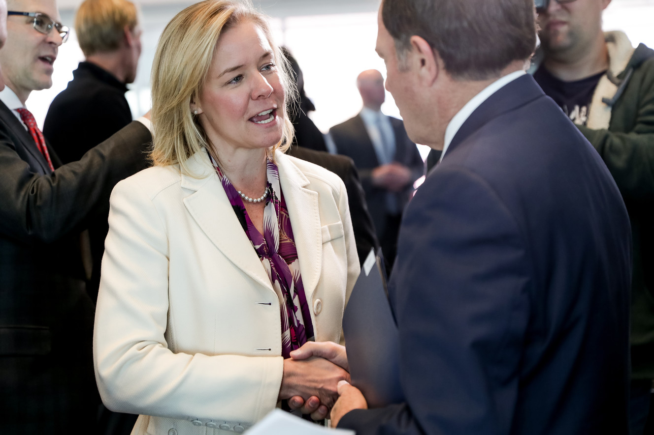 Sarah Hirschland, CEO of the U.S. Olympic Committee, shakes hands with Gov. Gary Herbert during a luncheon at the University of Utah's Rice-Eccles Stadium in Salt Lake City on Wednesday, Nov. 14, 2018. (Photo: Spenser Heaps, KSL)
