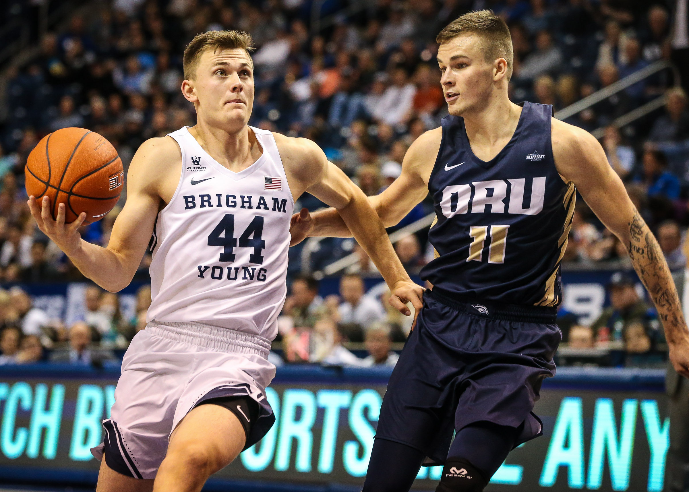 BYU guard Connor Harding (44) lays up the ball against Oral Roberts guard Carlos Jurgens (11) during a basketball game at Marriott Center in Provo on Thursday, Nov. 15, 2018. (Photo: Qiling Wang, Deseret News)